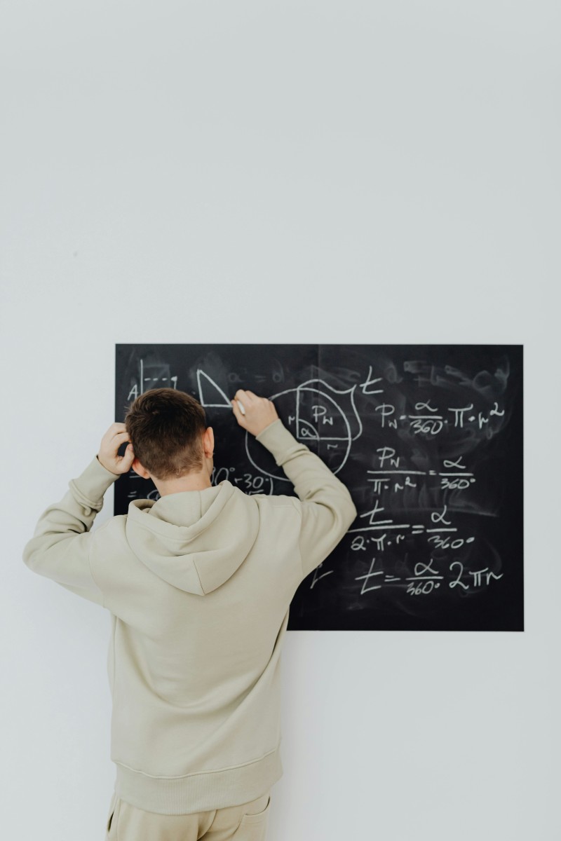 Man Confused at Blackboard