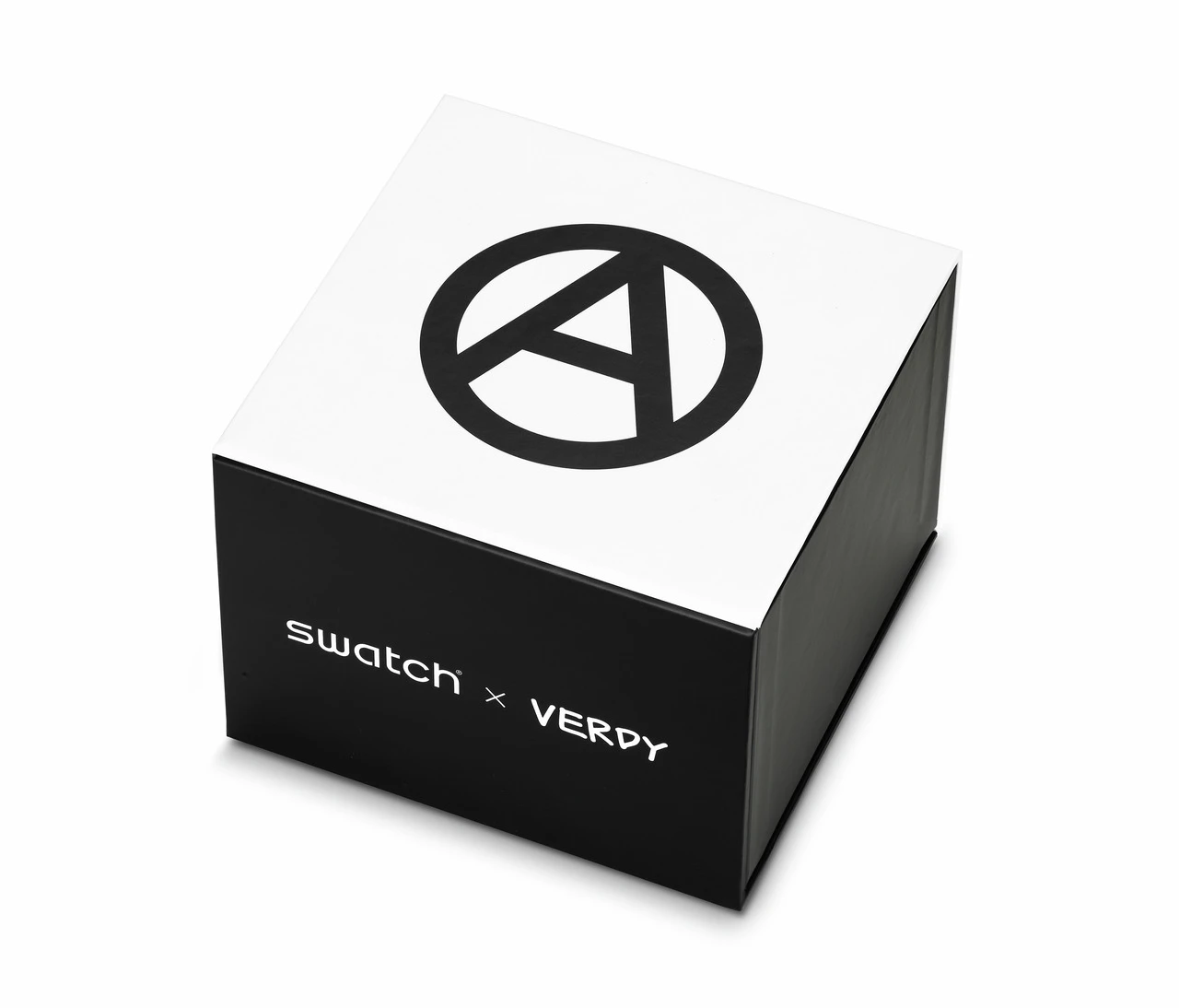 A swatch x verdy collaboration watch box, featuring a sleek black and white design with the verdy peace symbol on top and the collaboration logo on the side.