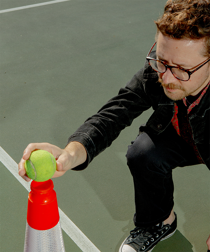 Alex Oskie holding a Tennis ball