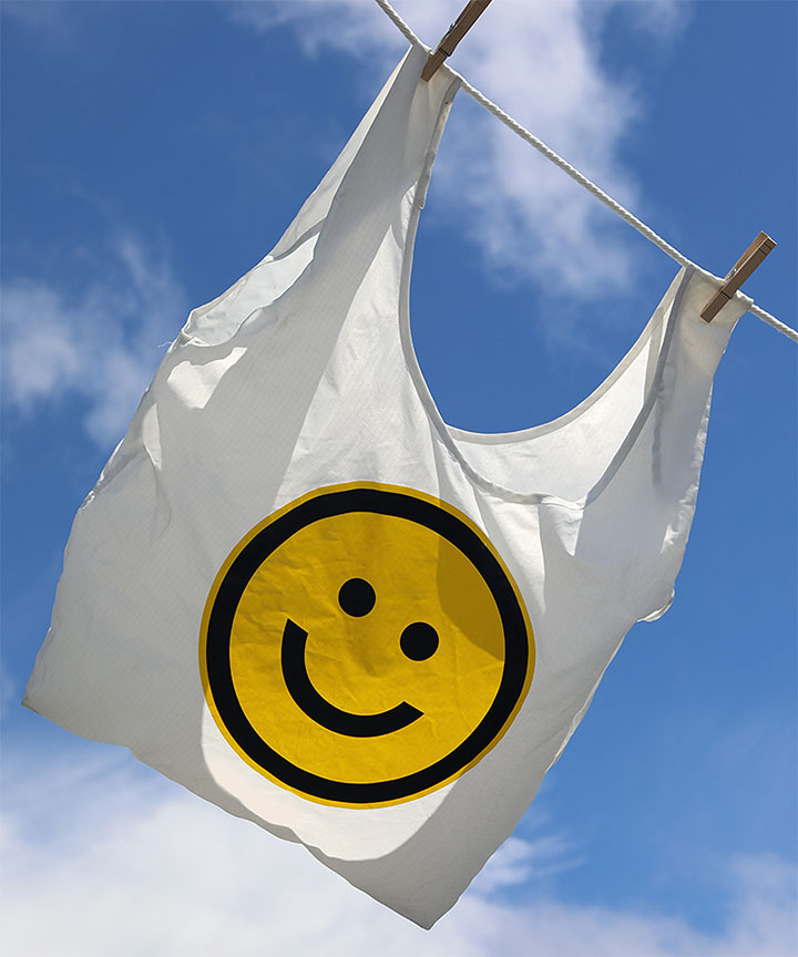 shopping bag with smiley face