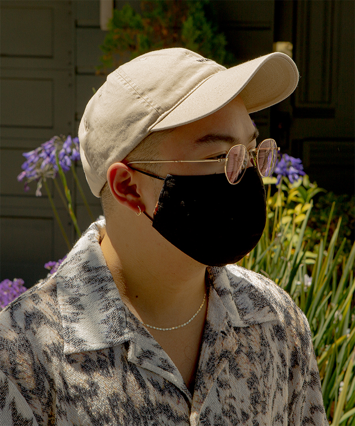 Kris wearing a black mask