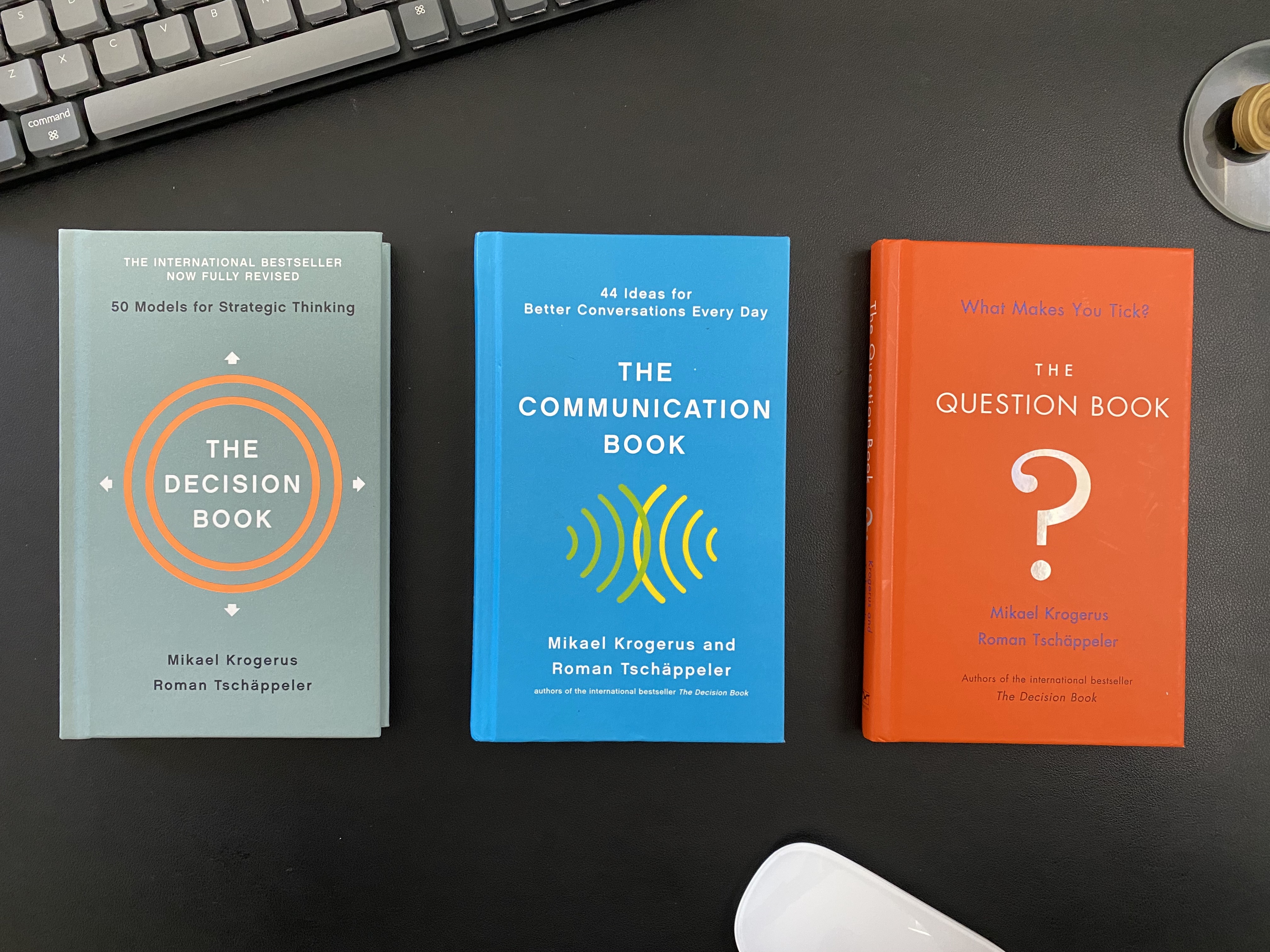 Image of three books: The Decision Book. The Communication Book. The Question Book.