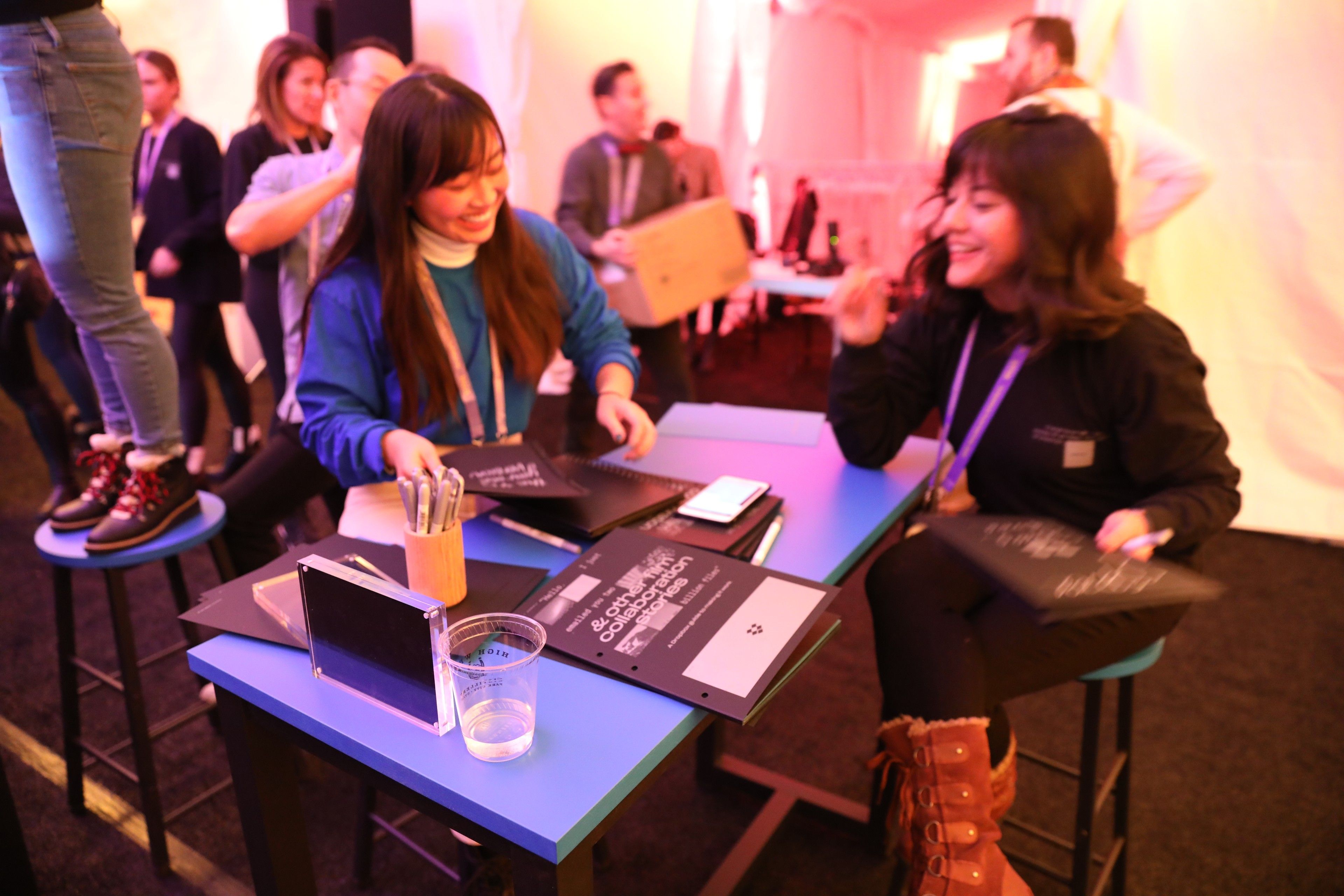 Theresa and Kelly from the Dropbox Brand Studio ready to distribute books at the Sundance Film Festival.