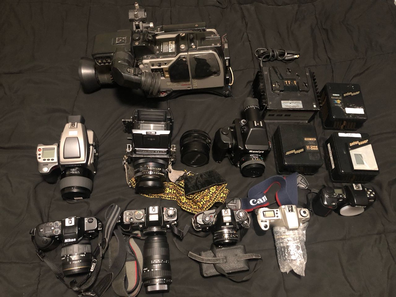 Omolayole’s camera collection displayed on his bed
