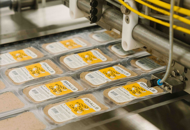 Packets of Smalls fresh food in the factory getting labels applied