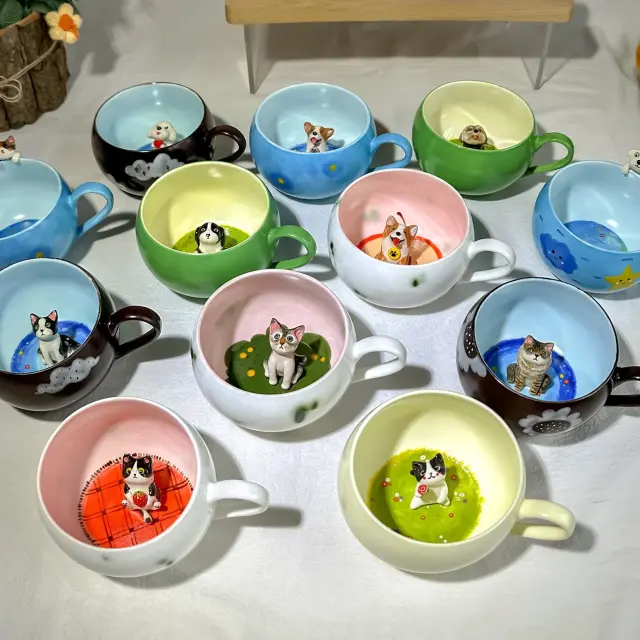 Adorable ceramic cups featuring miniature 3D animal designs inside, perfect for tea or coffee lovers who appreciate unique and artistic mugs. Each cup showcases intricate hand-painted details and vibrant colors, making them a charming gift for pet enthusiasts or a playful addition to your kitchen collection."