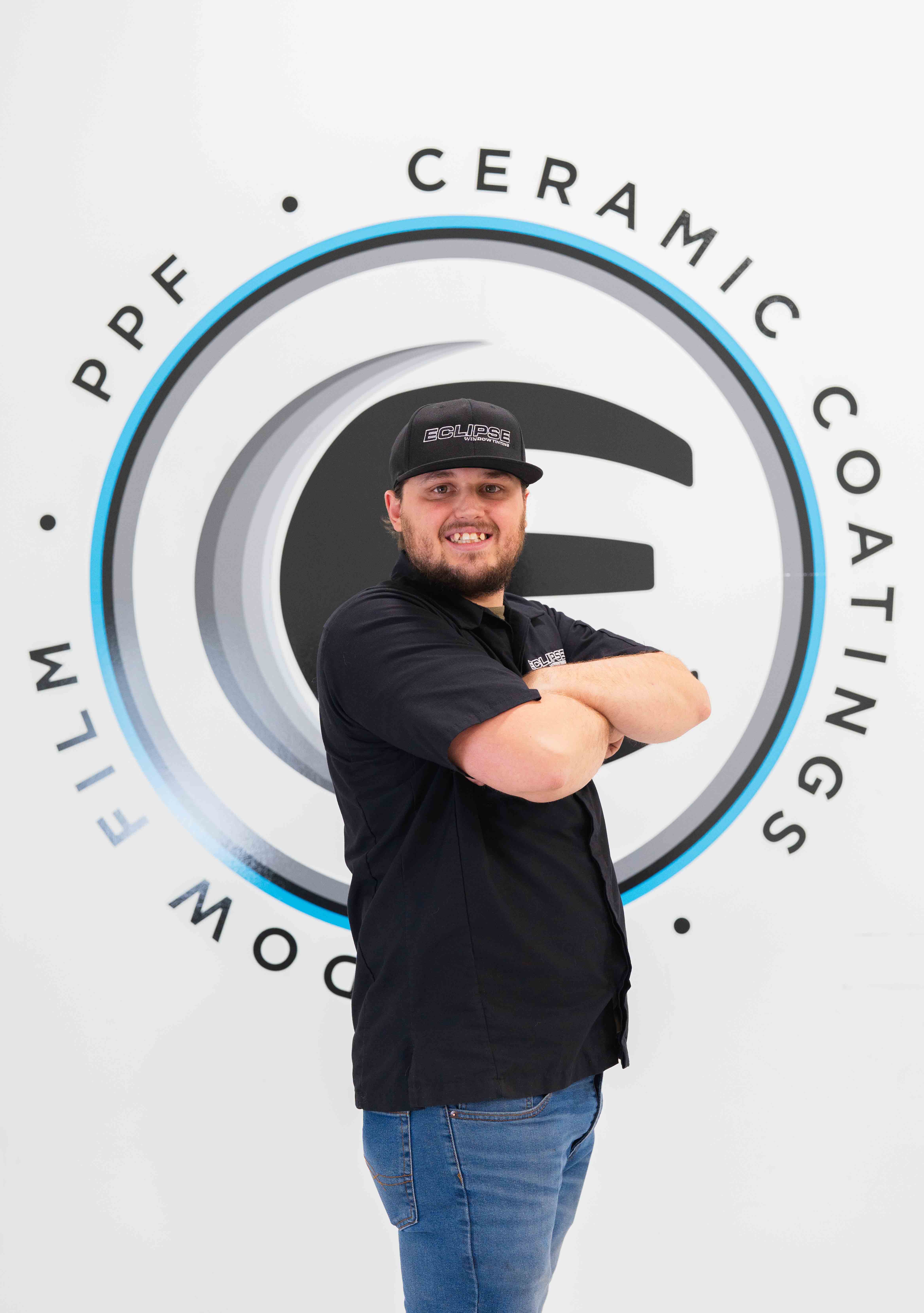 An expert tint installer at Eclipse Window Tinting.