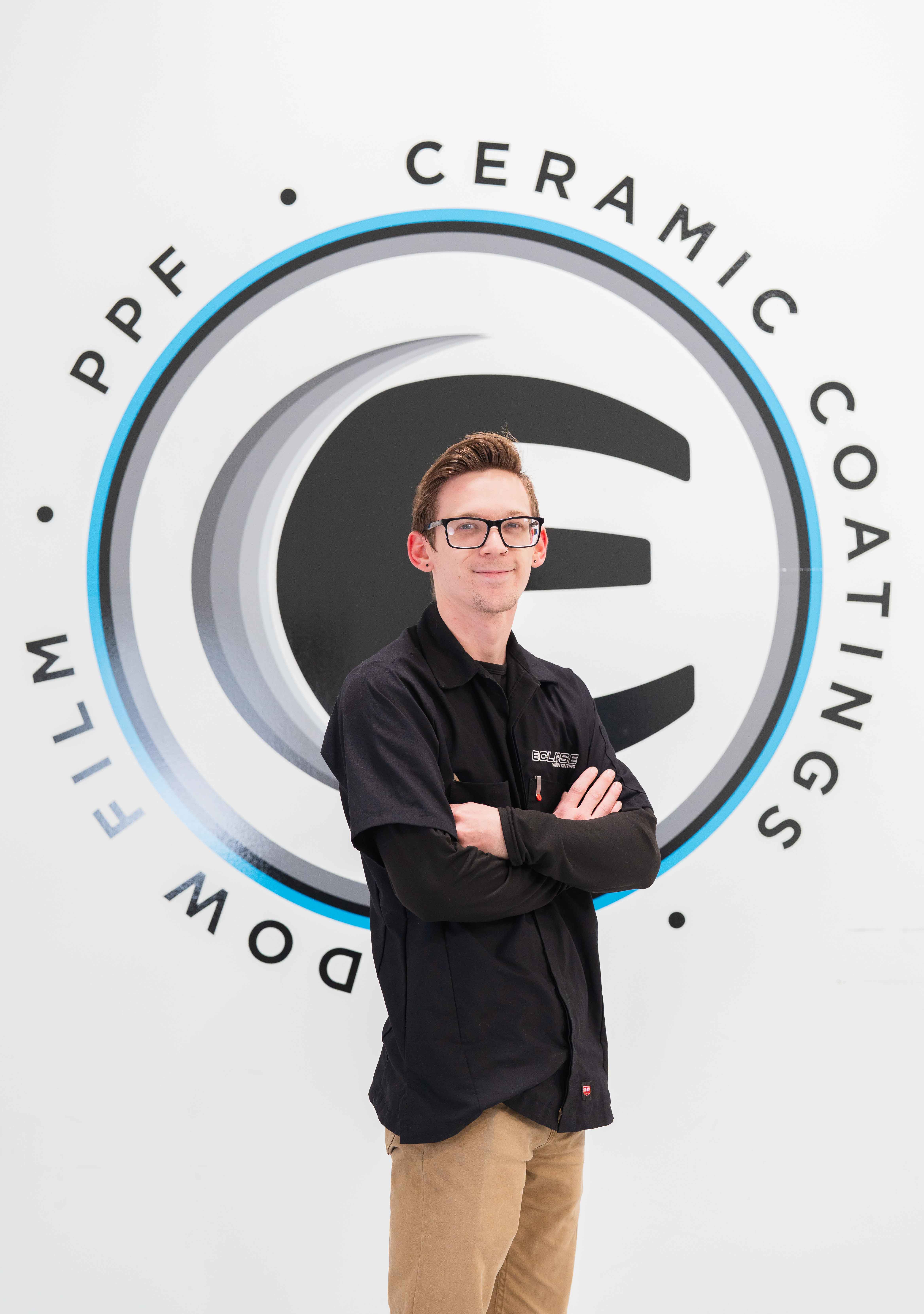 An expert tint installer at Eclipse Window Tinting.