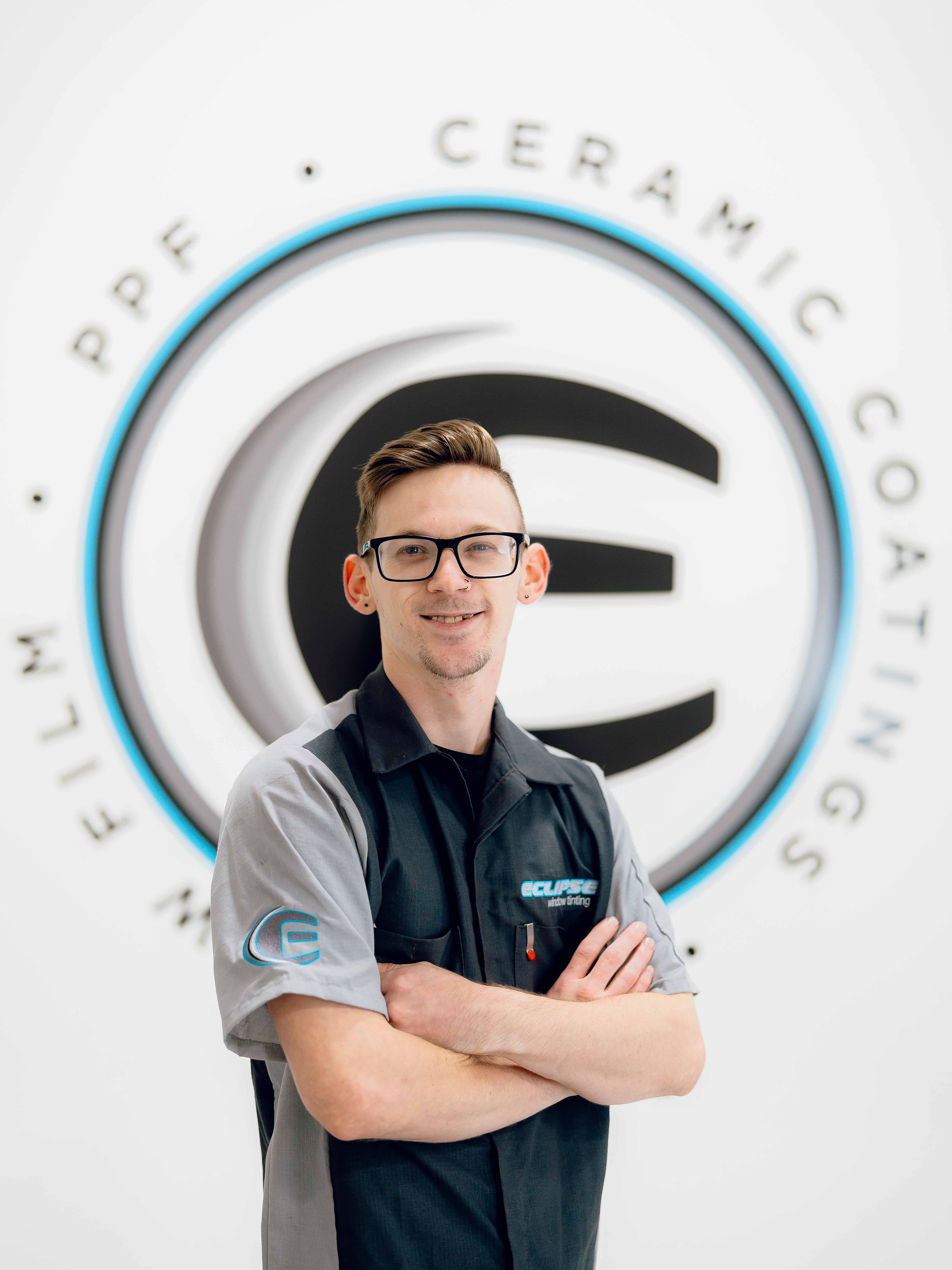 An expert tint installer at Eclipse Window Tinting.