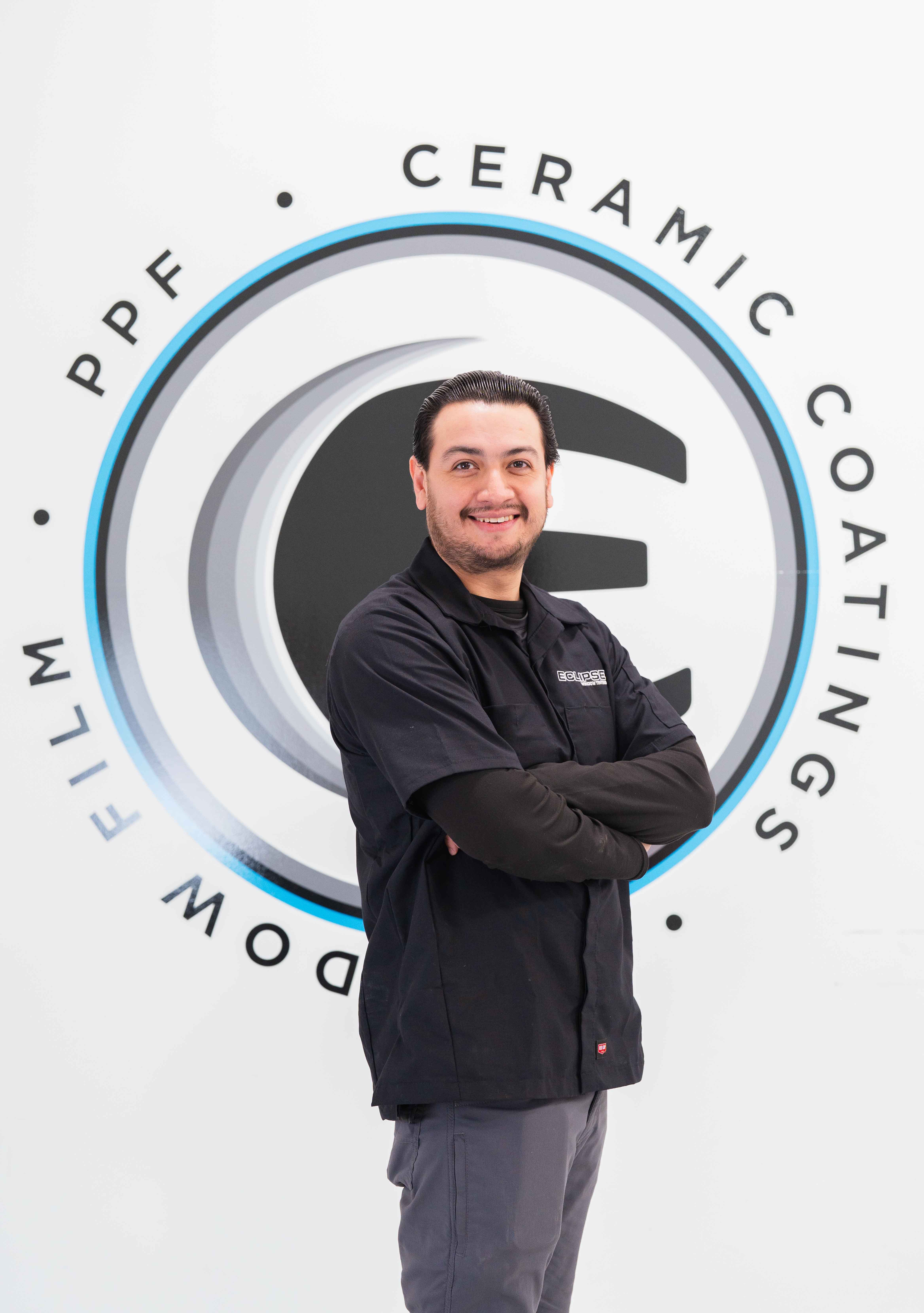 An expert tint installer at Eclipse Window Tinting.