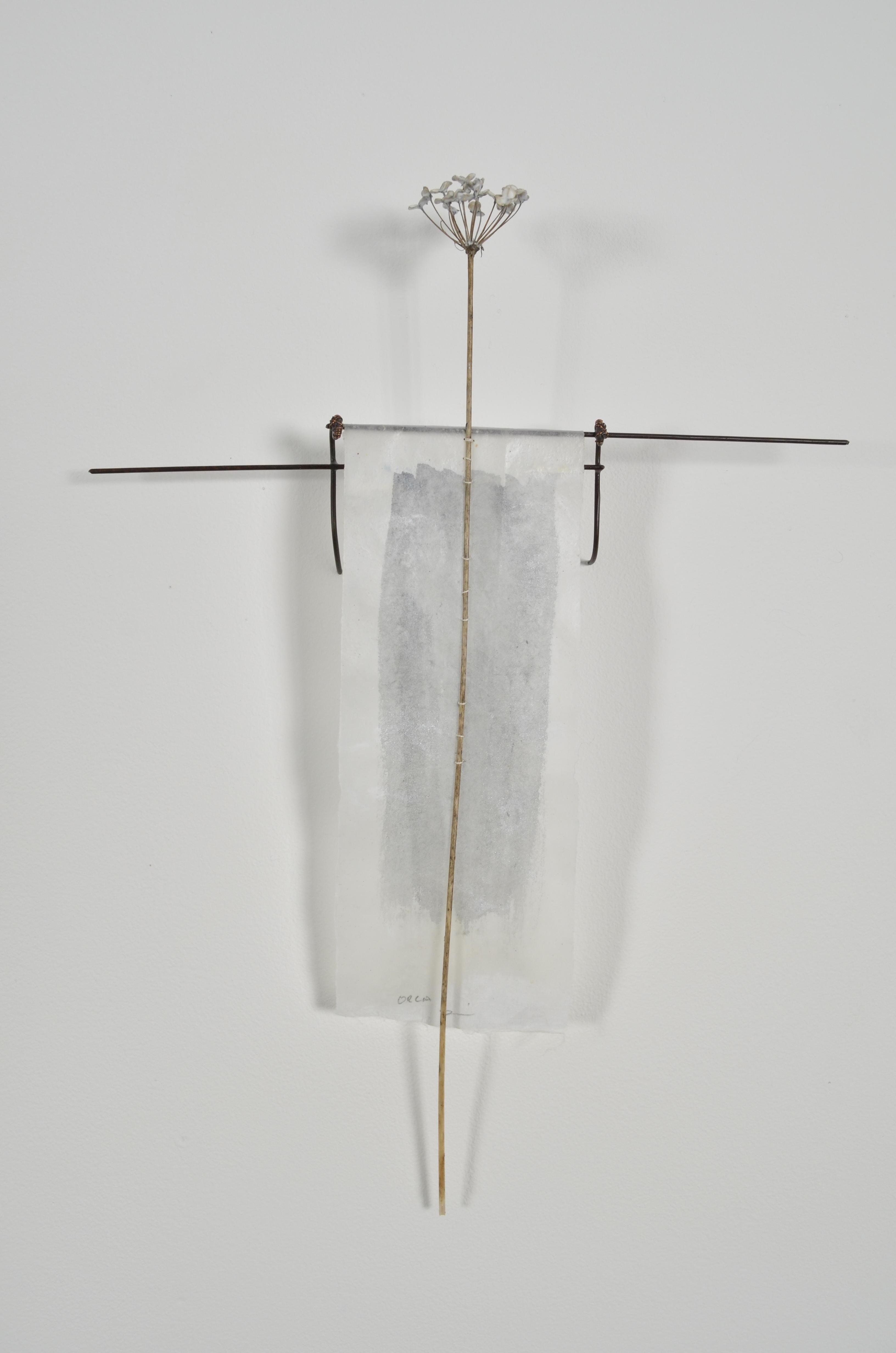 Bleached mulberry paper with water color is sealed in encaustic, wrapped liked a paper doll dress over the found fence section of arms with an allium sealed in encaustic is sewn on top of the dress.