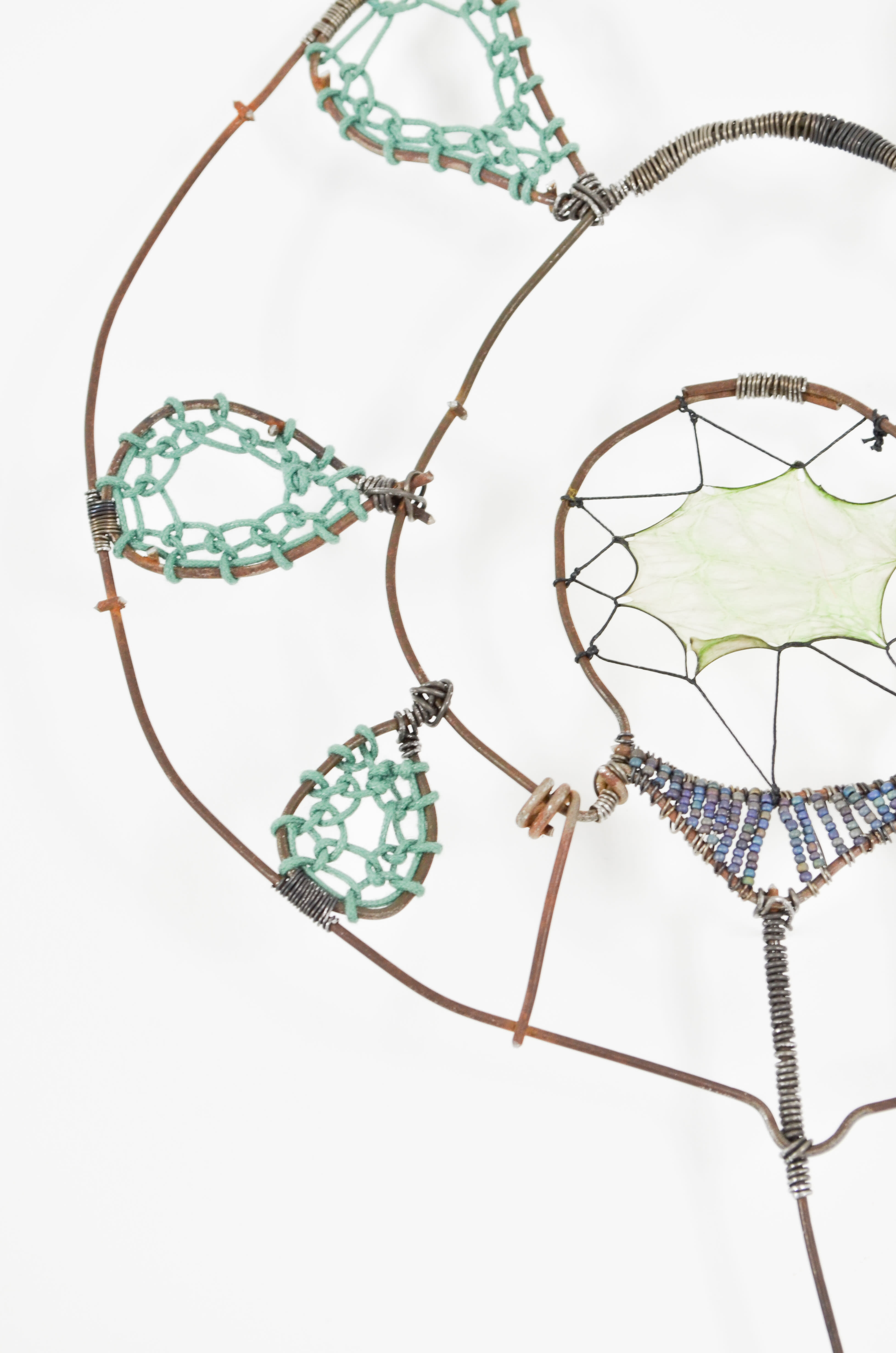 Harrison is a wallflower with up-cycled fence, stained gut, thread, seed beads ,& paper thread - looping and sewing techniques are a part of this work,  mixed media, 23.5"h x 8.5"w 