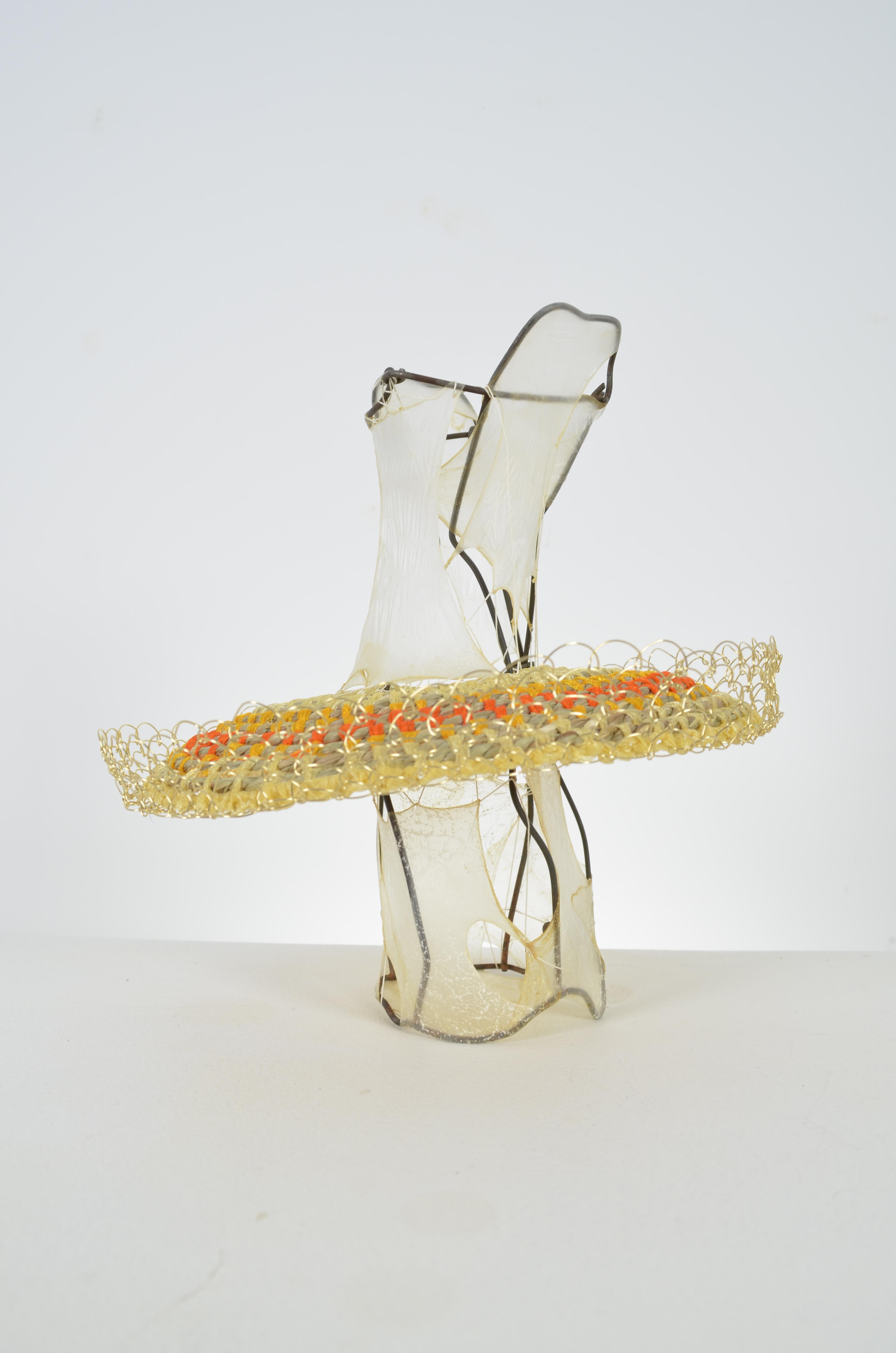 found fence, gut, seagrass, chiffon ribbon, & brass wire