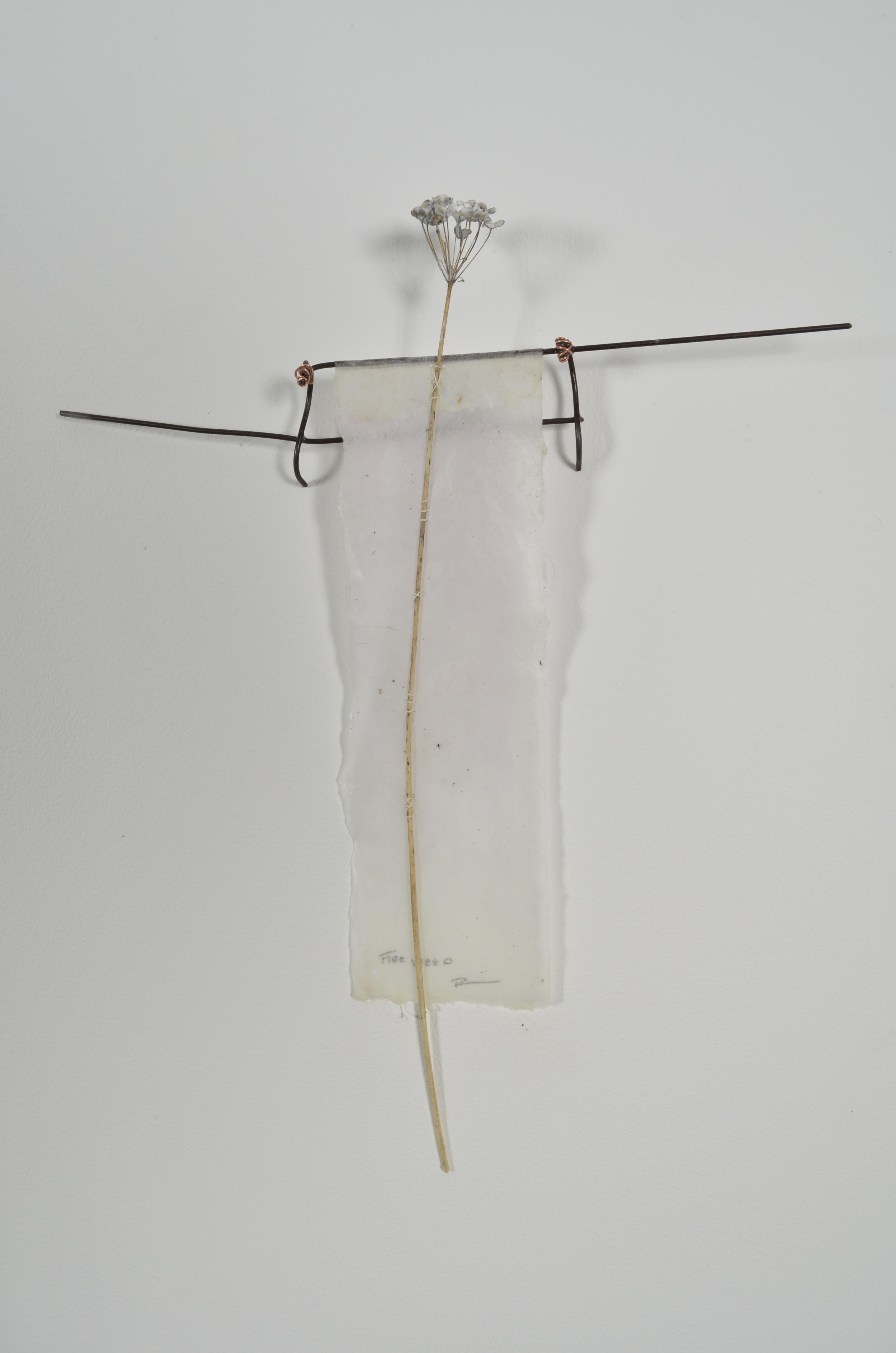 Bleached mulberry paper with water color is sealed in encaustic, wrapped liked a paper doll dress over the found fence section of arms with an allium sealed in encaustic is sewn on top of the dress.