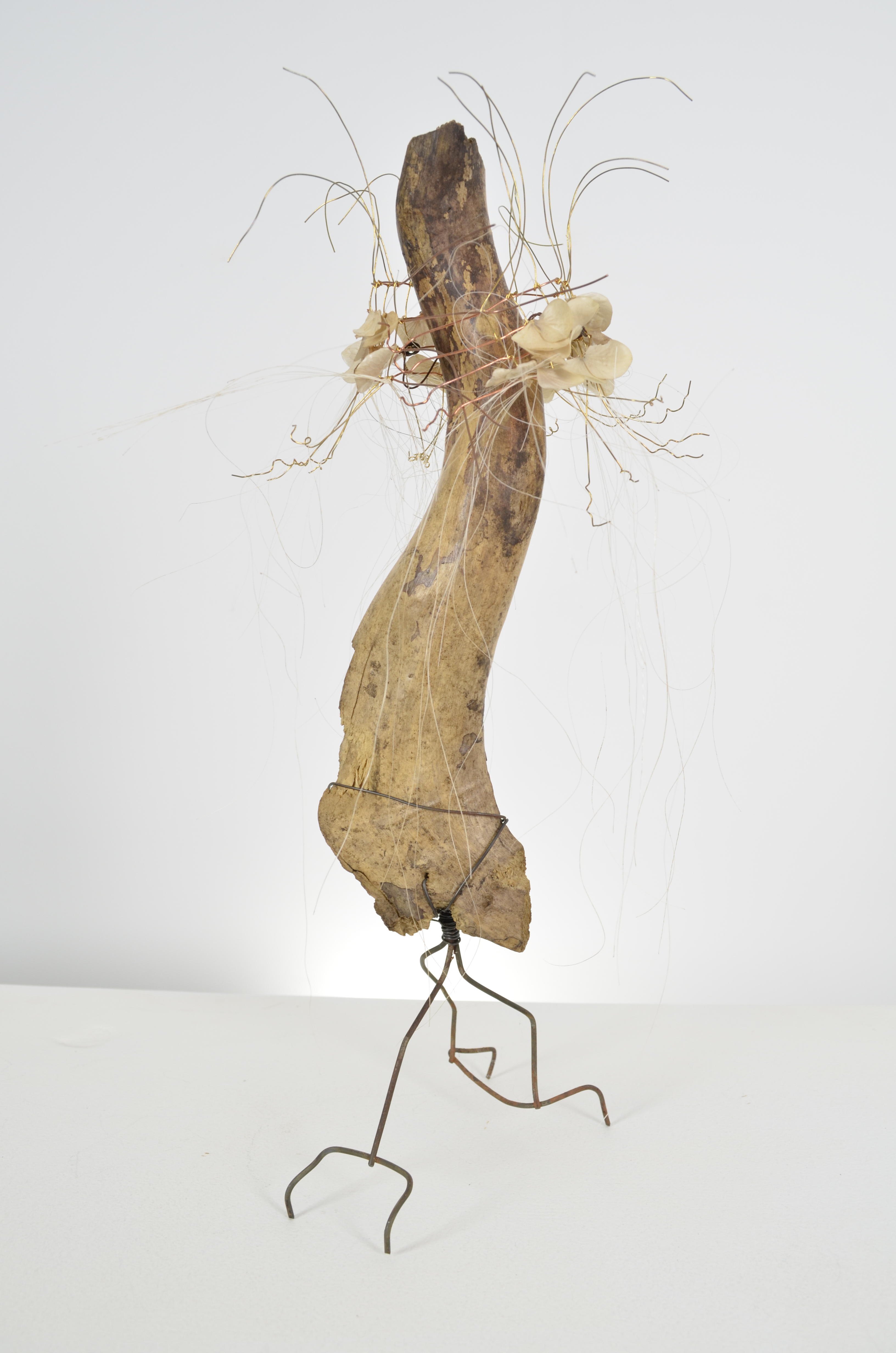 The wood is sealed in encaustic and a gift from a friend.  I decided she needed a night out and so includes a shawl of hand knotted wire & individual hydrangea flowers sealed in encaustic and found fence. 15X7X7