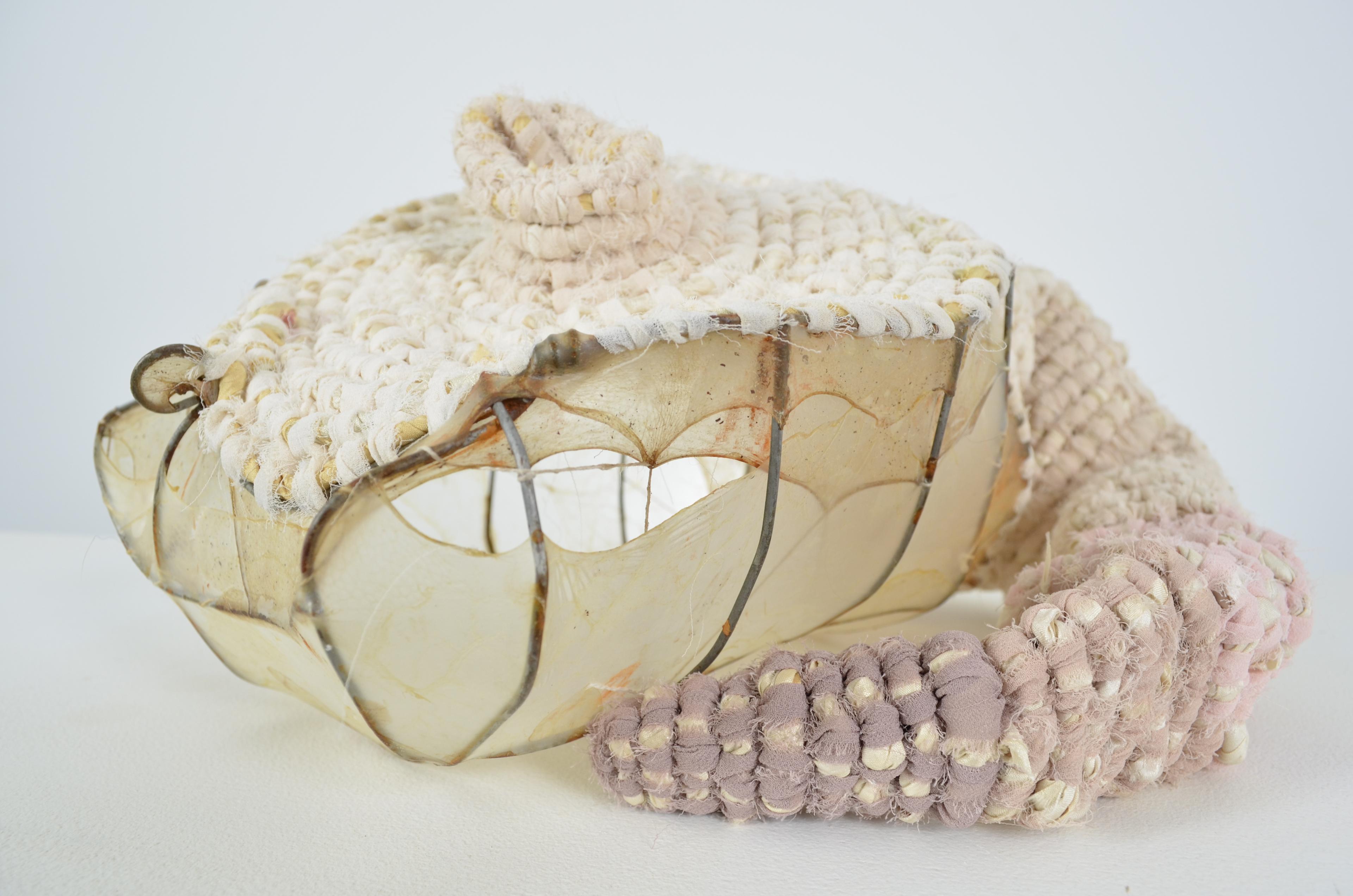 Sewn & stretched gut are wrapped around shaped found fence with coiled upcycled sari & chiffon finishing the vessel. 7x12.75x10