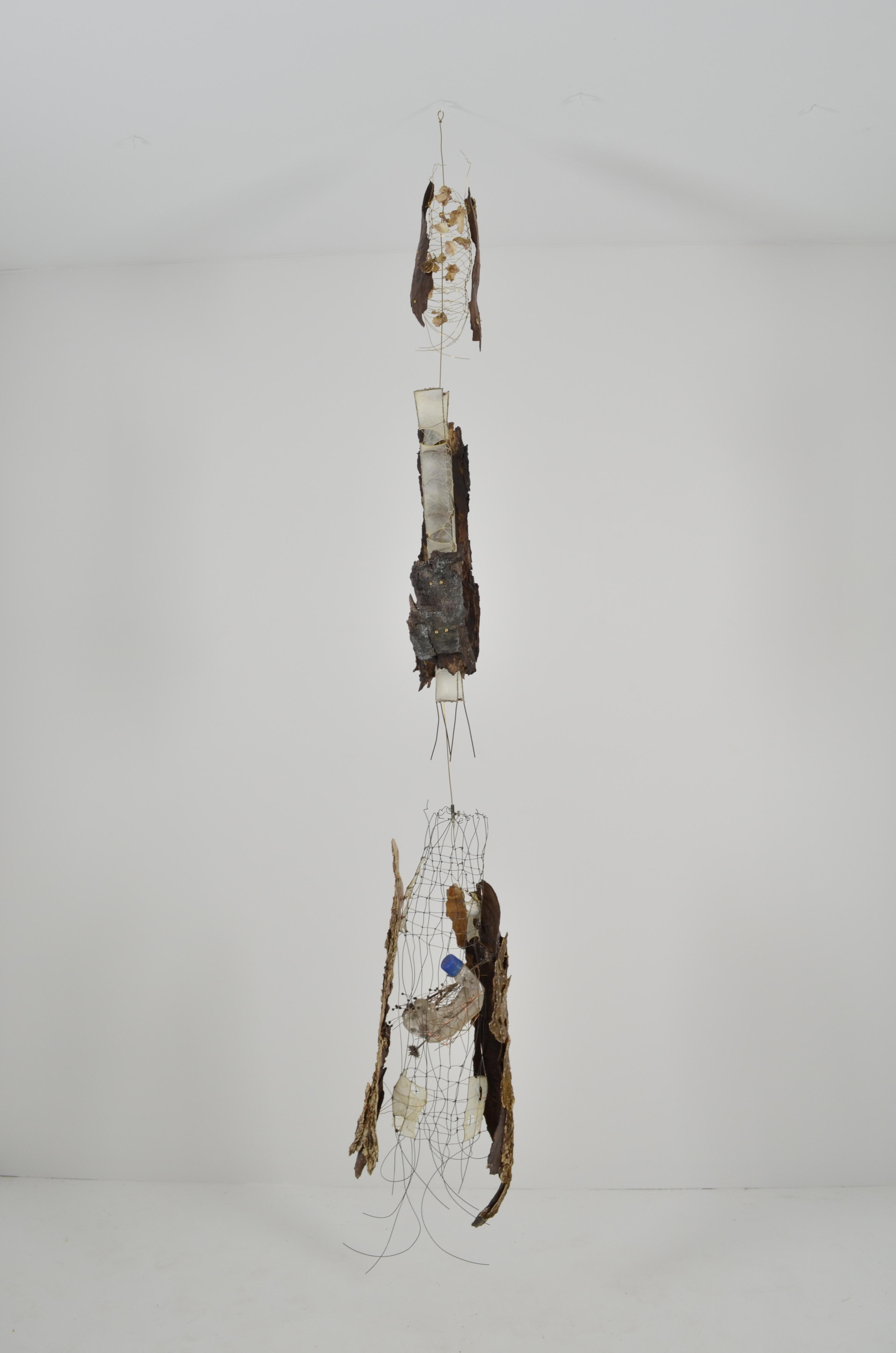 Found ephemera all sealed in encaustic, gut, found fence, wire, plastic bottles, have been sectioned together to create a tree.  