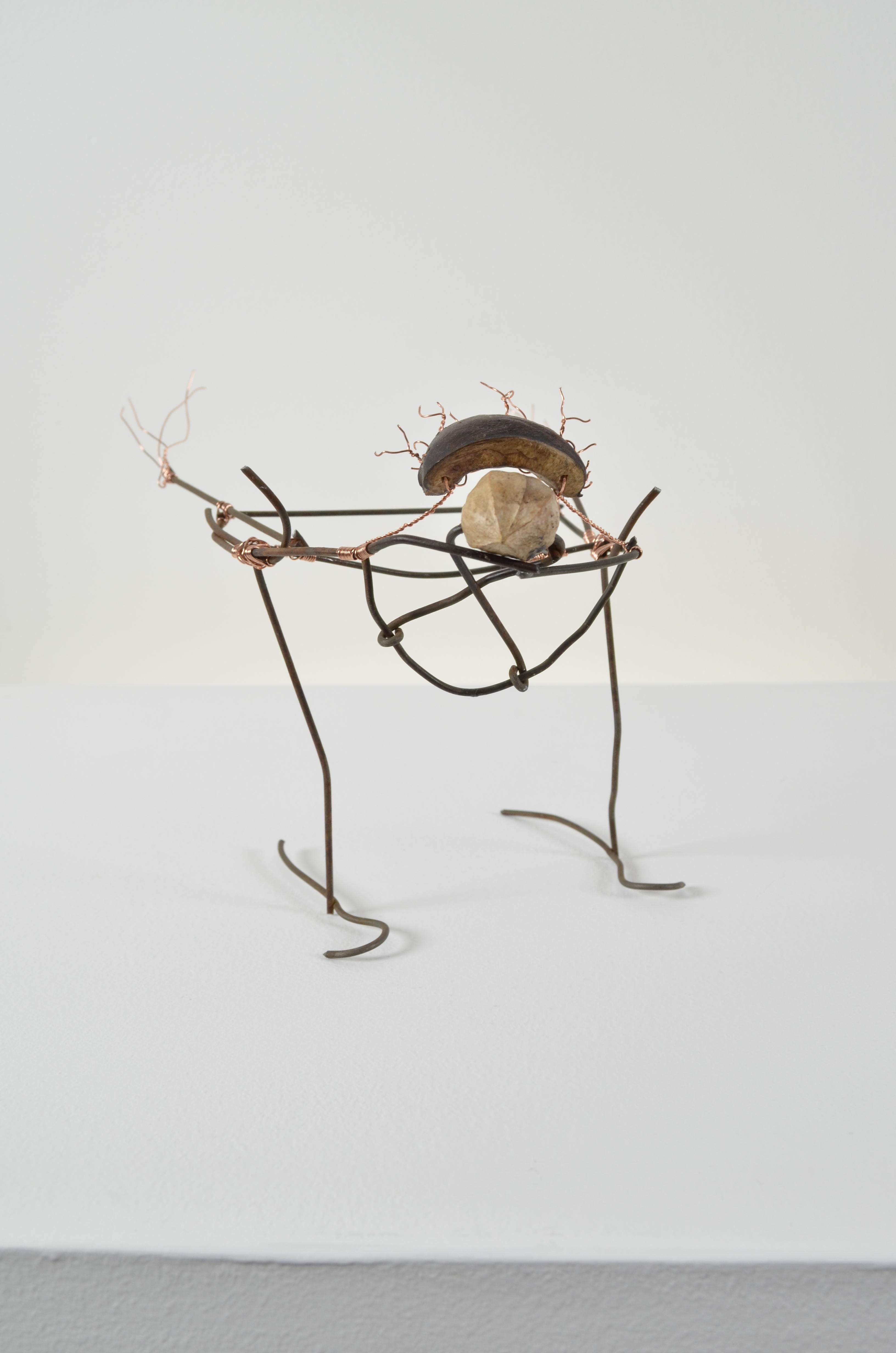 Gerty is an abstract bird made from found fence, copper wire, & walnuts.  SOLD