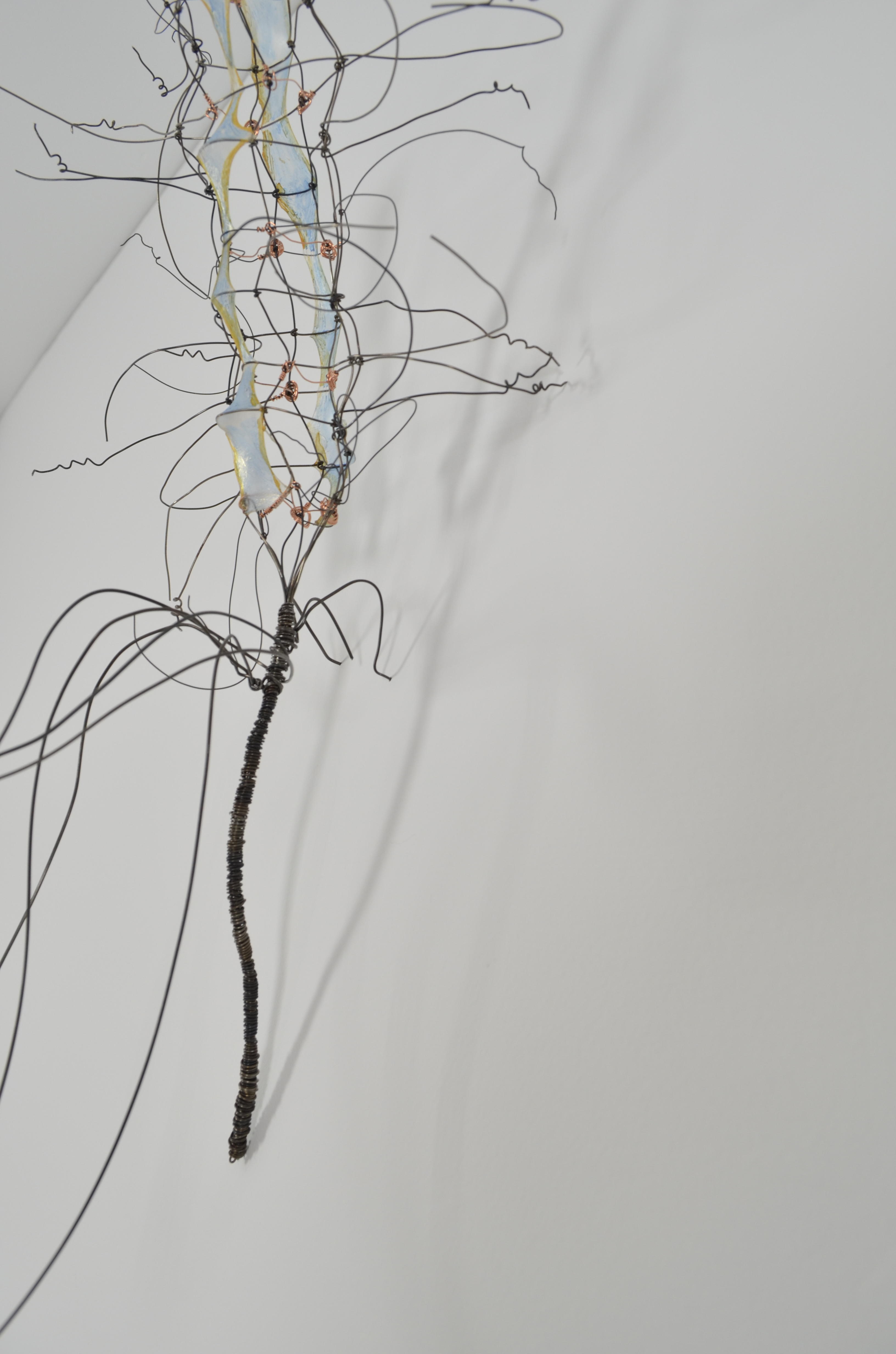 Woven and knotted layers of annealed steel wire with a touch of copper wire and water colored gut.  Like all the wallflower flowers they seamlessly pin into the wall.