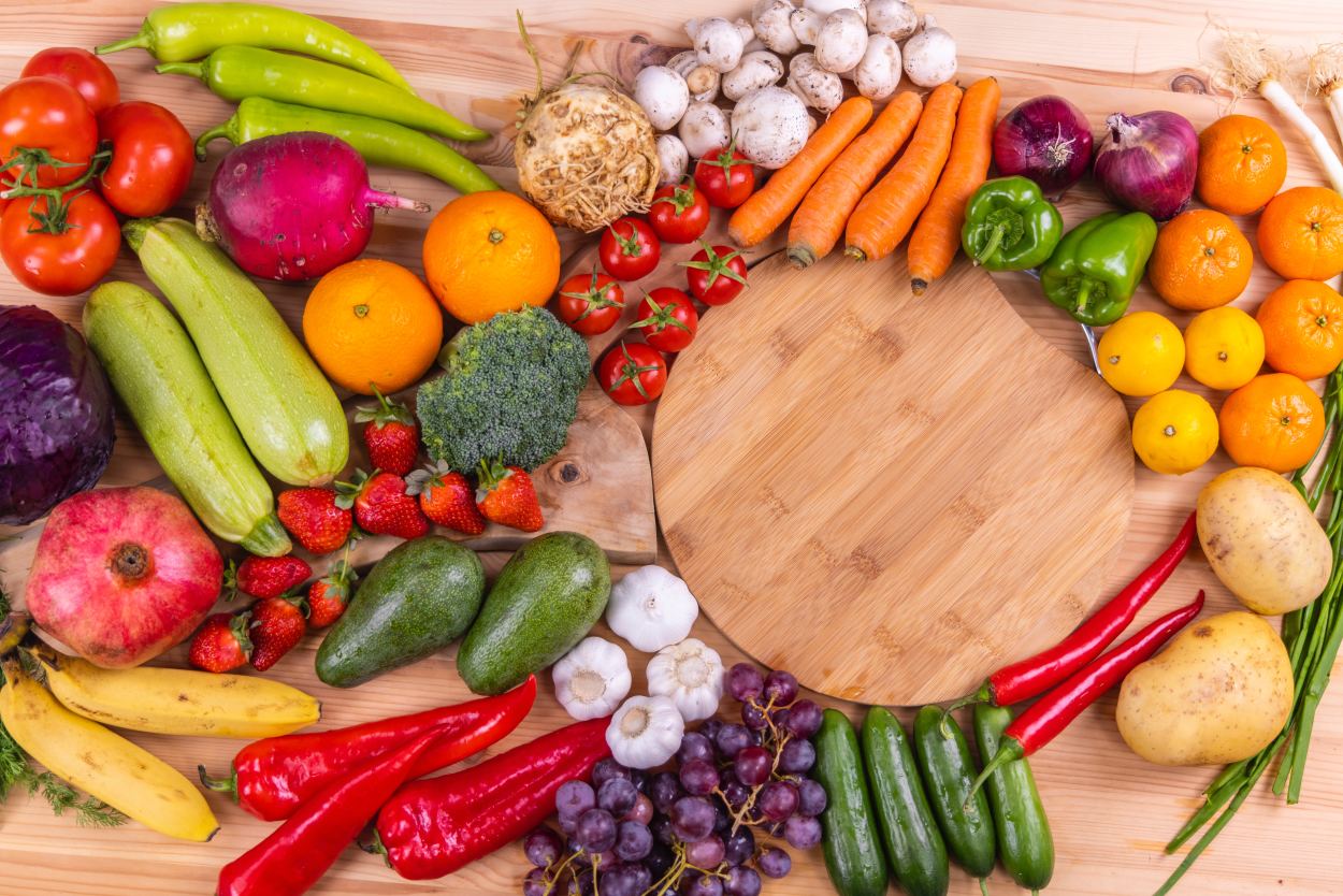 Vegetables on table by cutting board