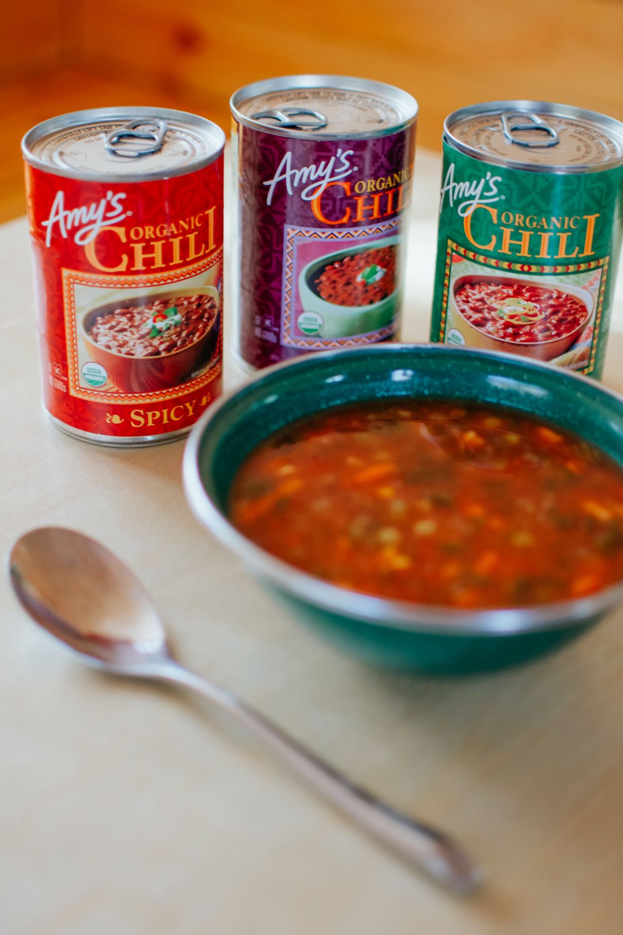 Amy's chili cans with bowl of chili