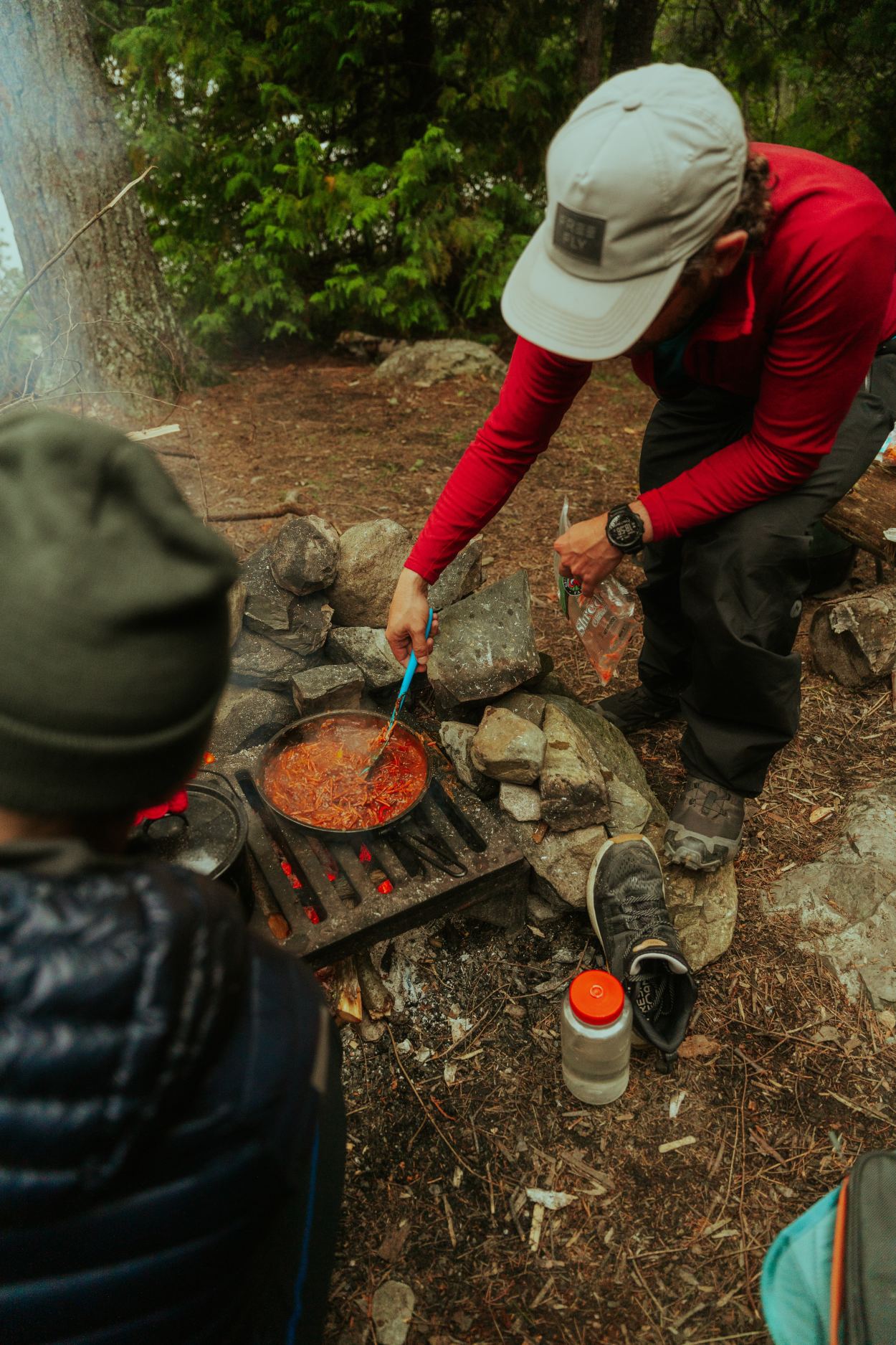 Cooking over fire while camping