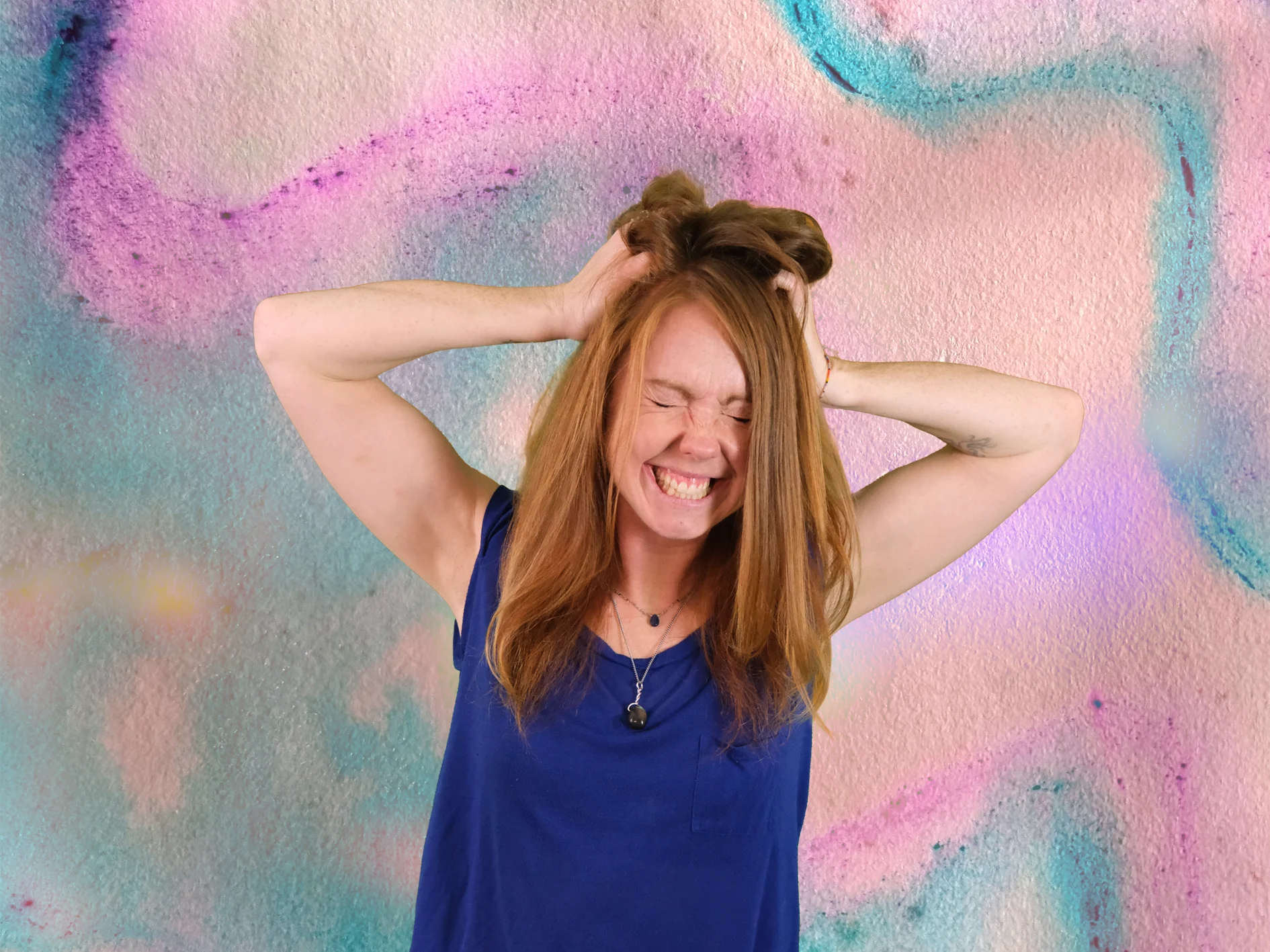 Image of a watercolour background with Viki holding her hands to her hair and grimacing as if she has made a mistakes