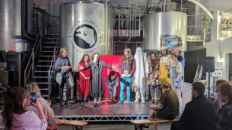 Modern Art May 1 Comedians on stage celebrating the end of a show