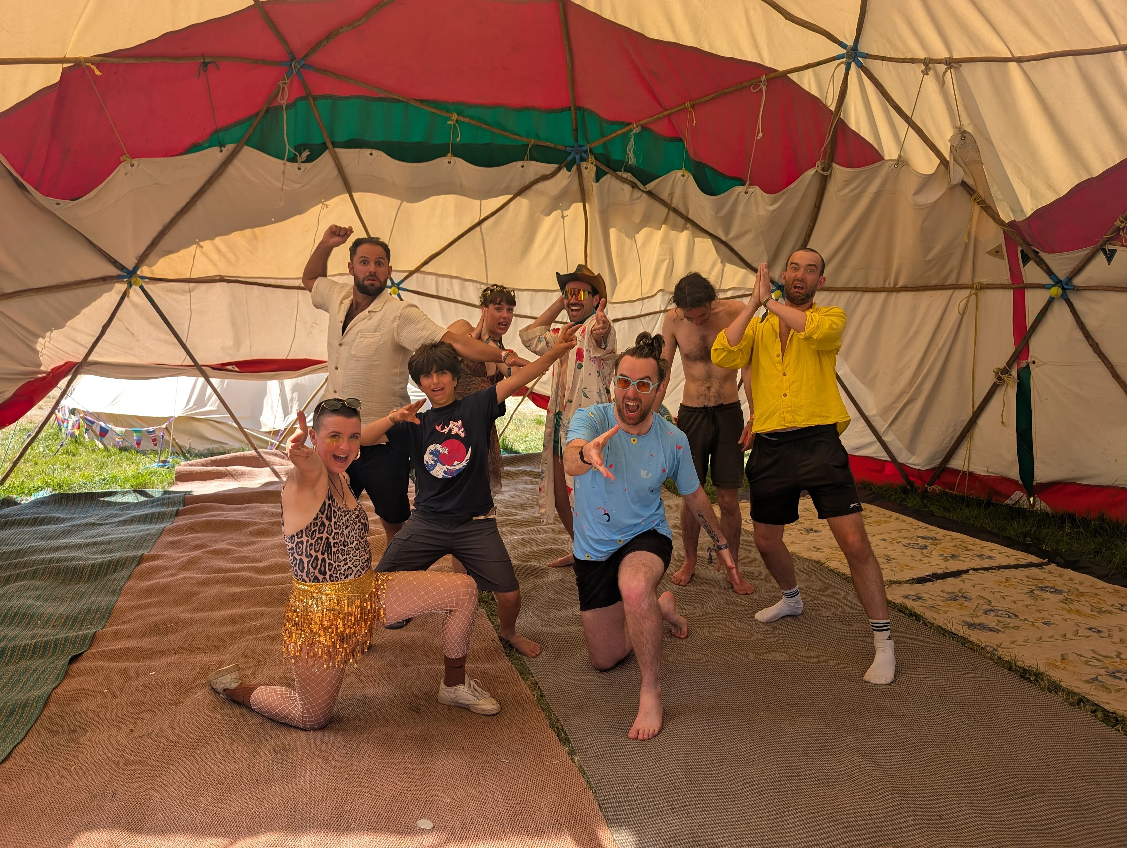 Group of people posing inside a yurt