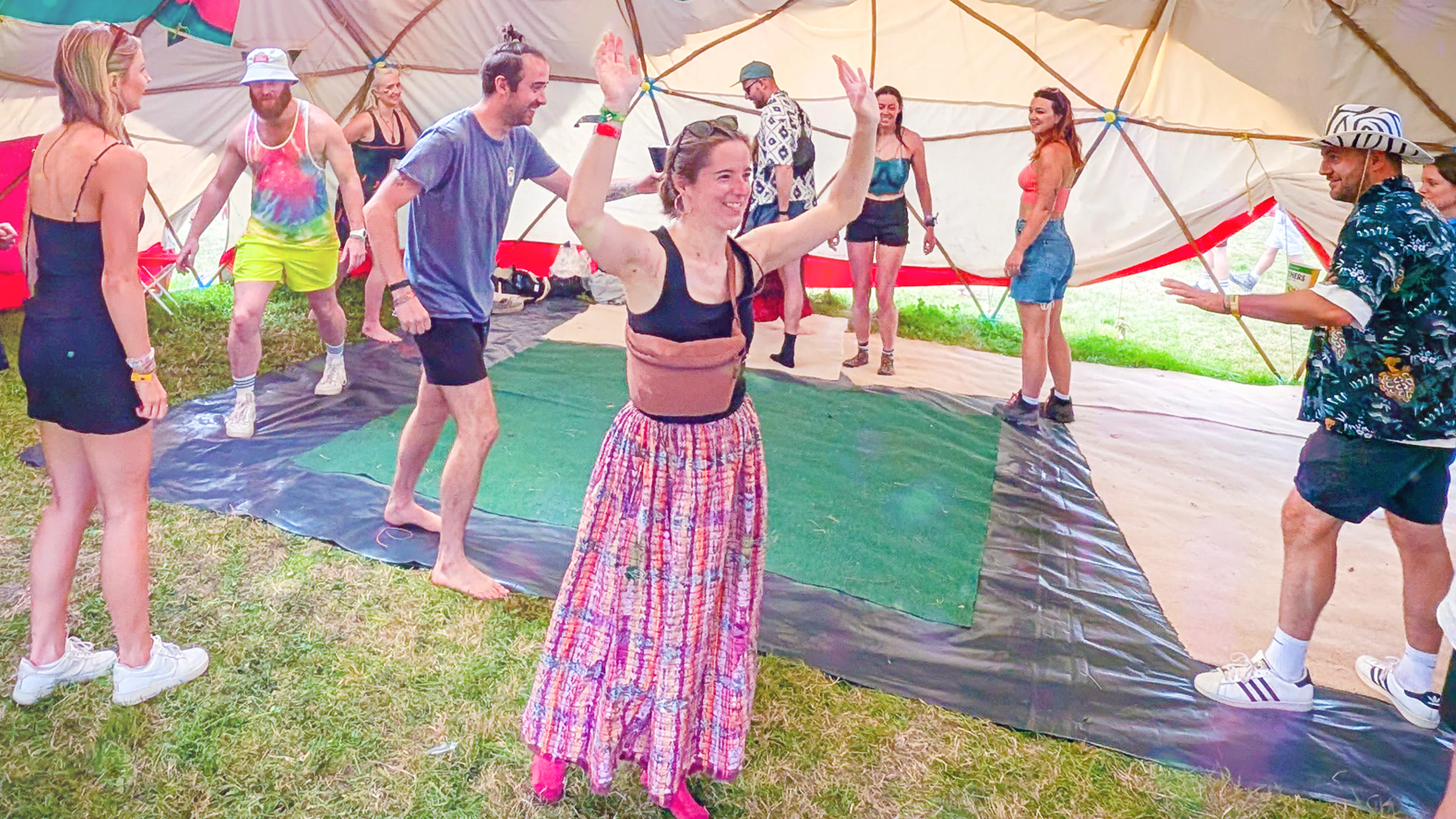 Glastonbury Workshop People in a workshop celebrating and walking around inside a tent