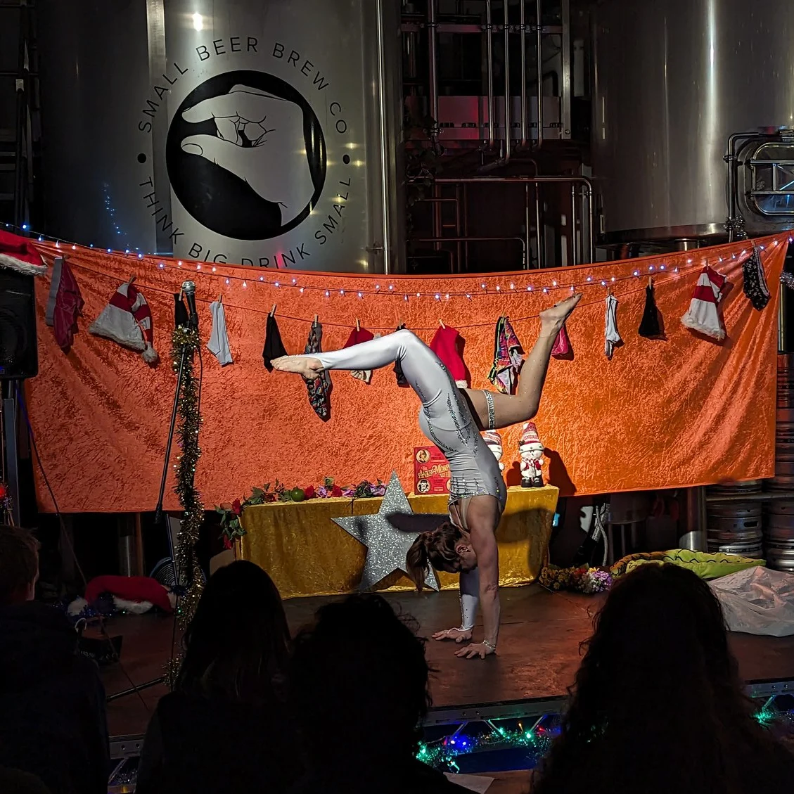 Amy Slevin performing Modern Art Dec Performer doing a handstand on stage