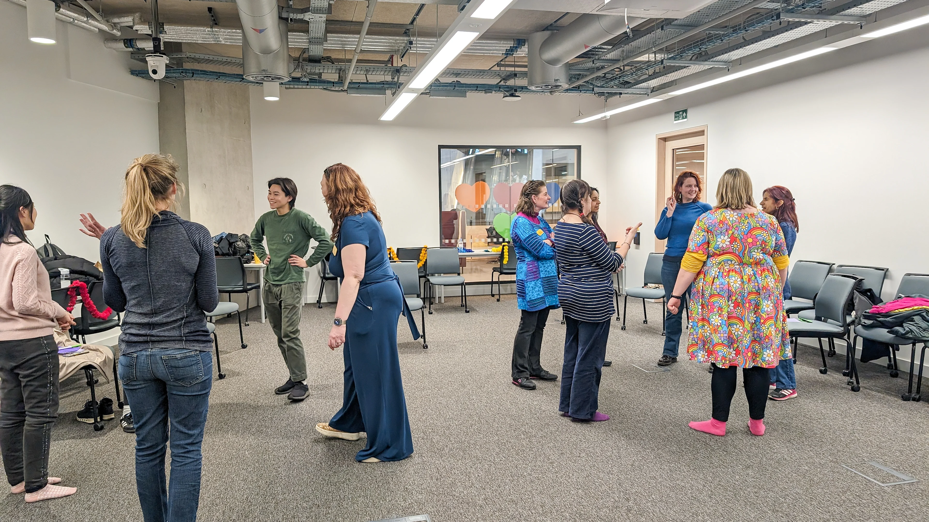 Mindful Workshop - UCL Mindful Workshop with two circles of people stood talking