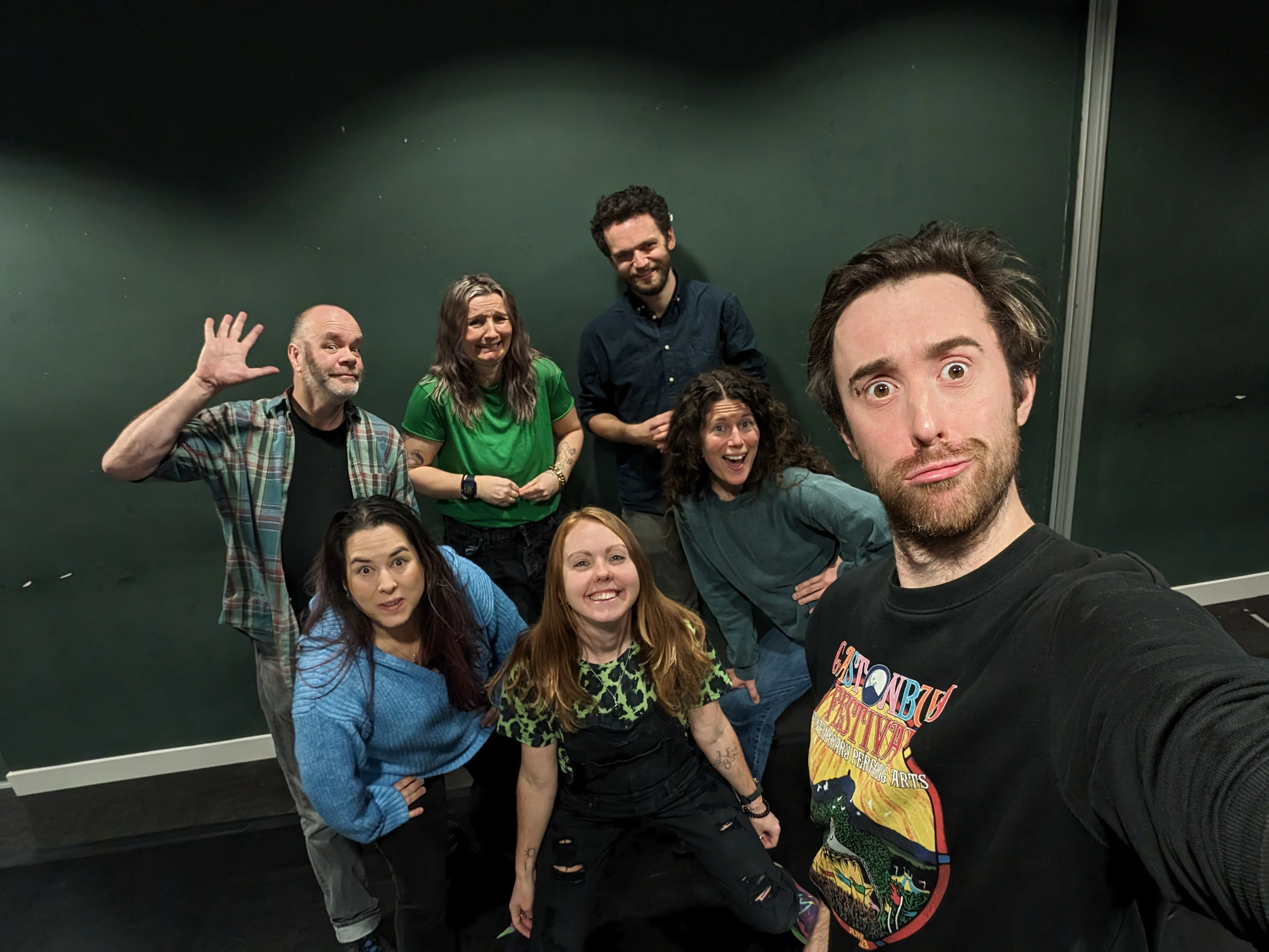 Improv team gathering for a photo 