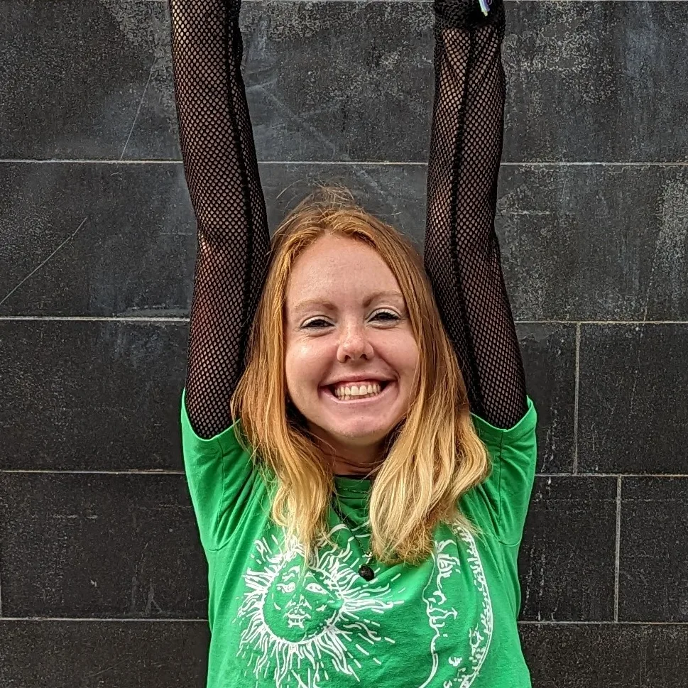 Small Viki Mindfulness Happy Image of a woman, Viki Jackson, with her hands in the air smiling