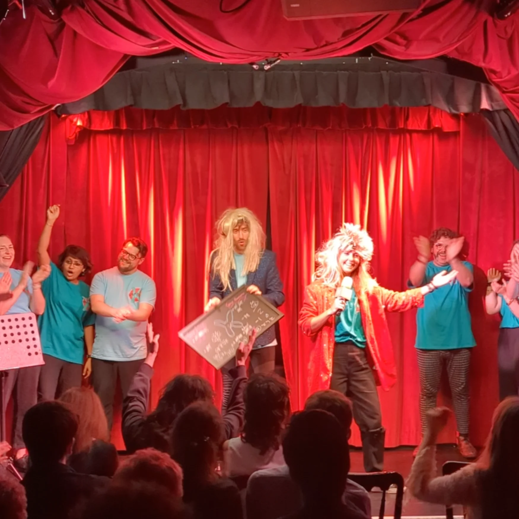 Kerfuffle presents TheatreSports at the Camden Fringe 2023 The Kerfuffle improv comedy team on stage at the Museum of Comedy performing their TheatreSports show. 10 people on stage, applauding as results are being announced.