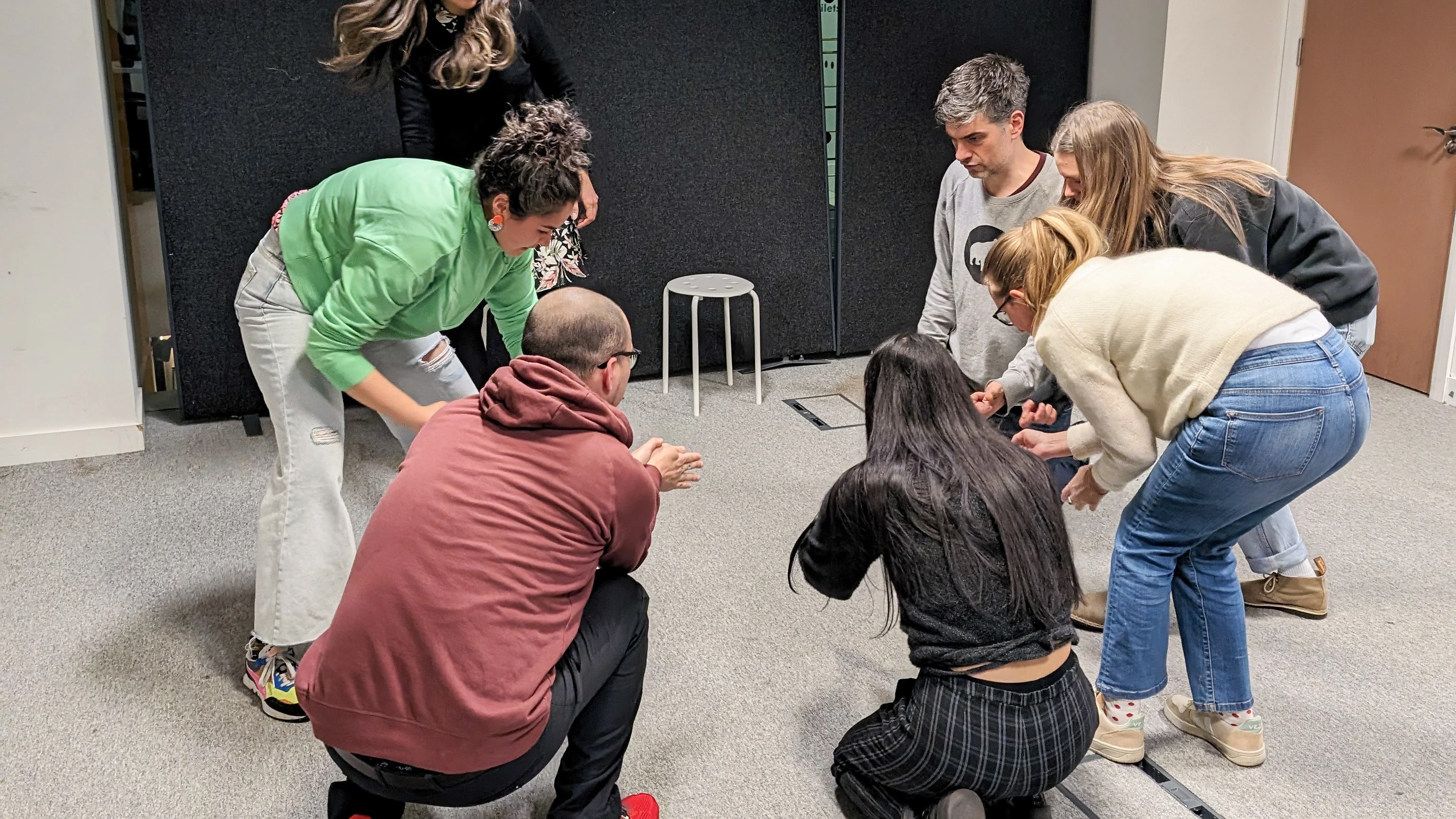 Play Workshop Image Image of people crouched down on the floor playing