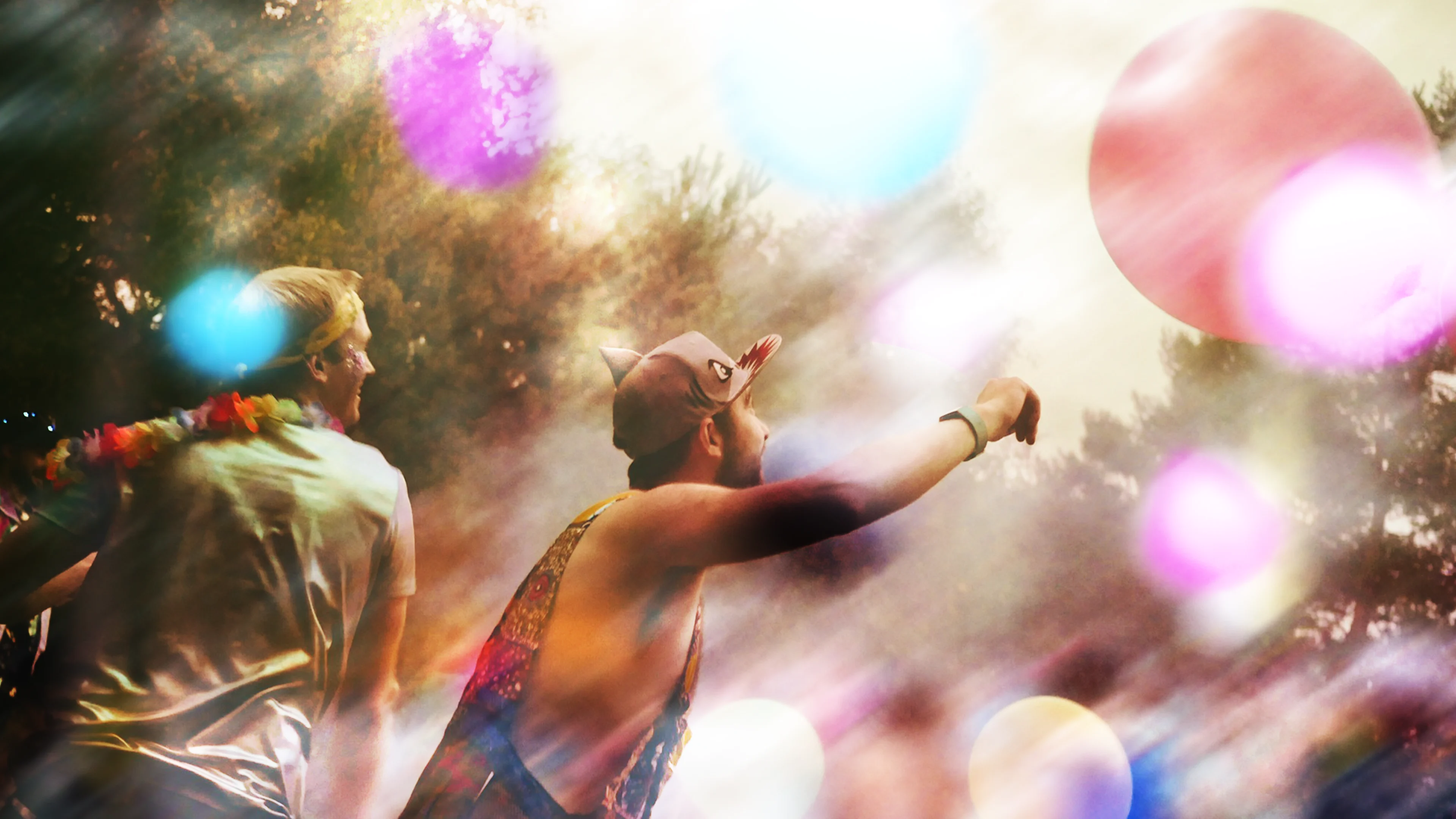 Woods play balloons Abstractly shown image of men playing with giant balloons in a woodland