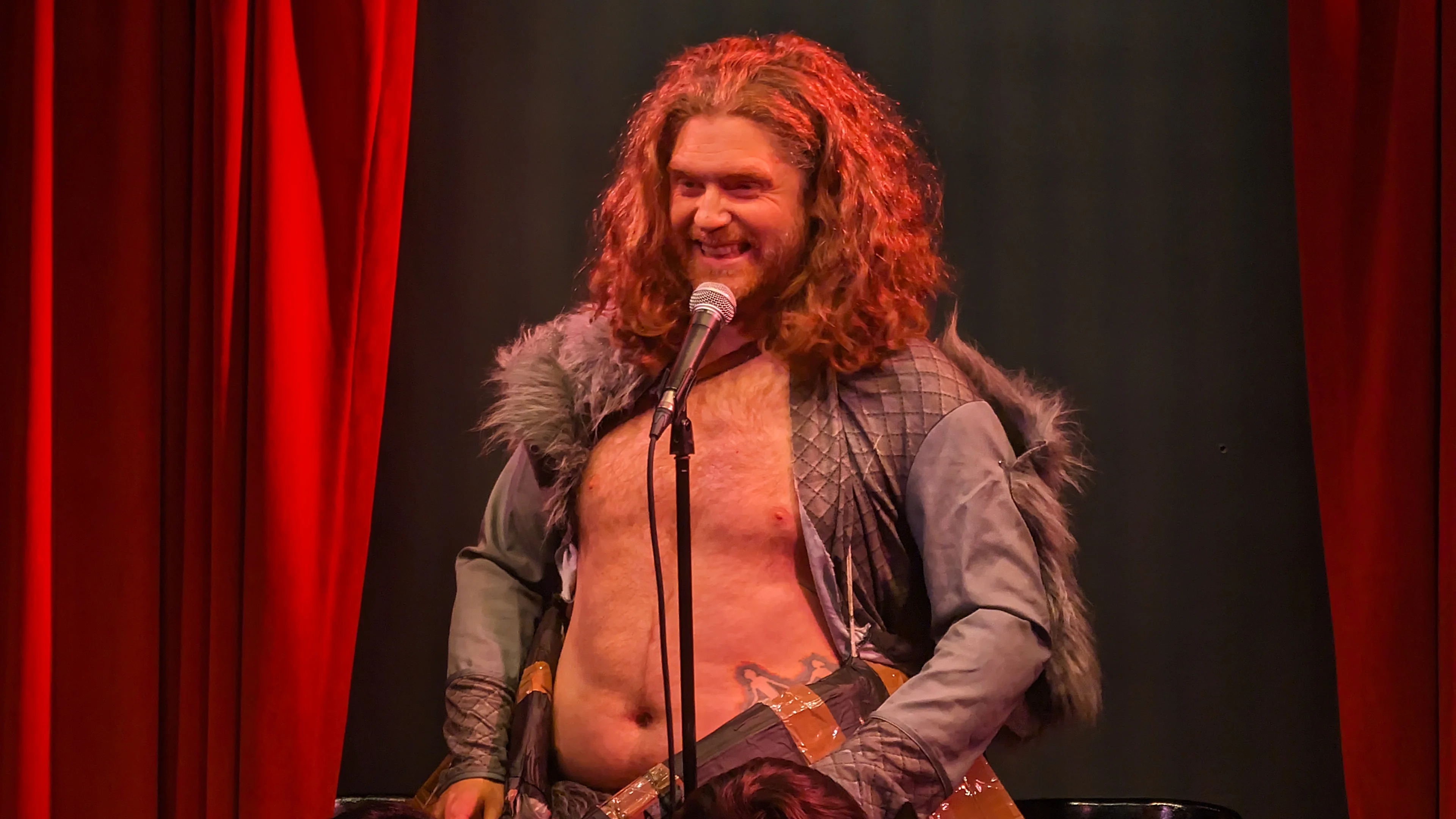David Hoskin is the Viking! David Hoskin on stage dressed up as a viking and has a boat attached to him.