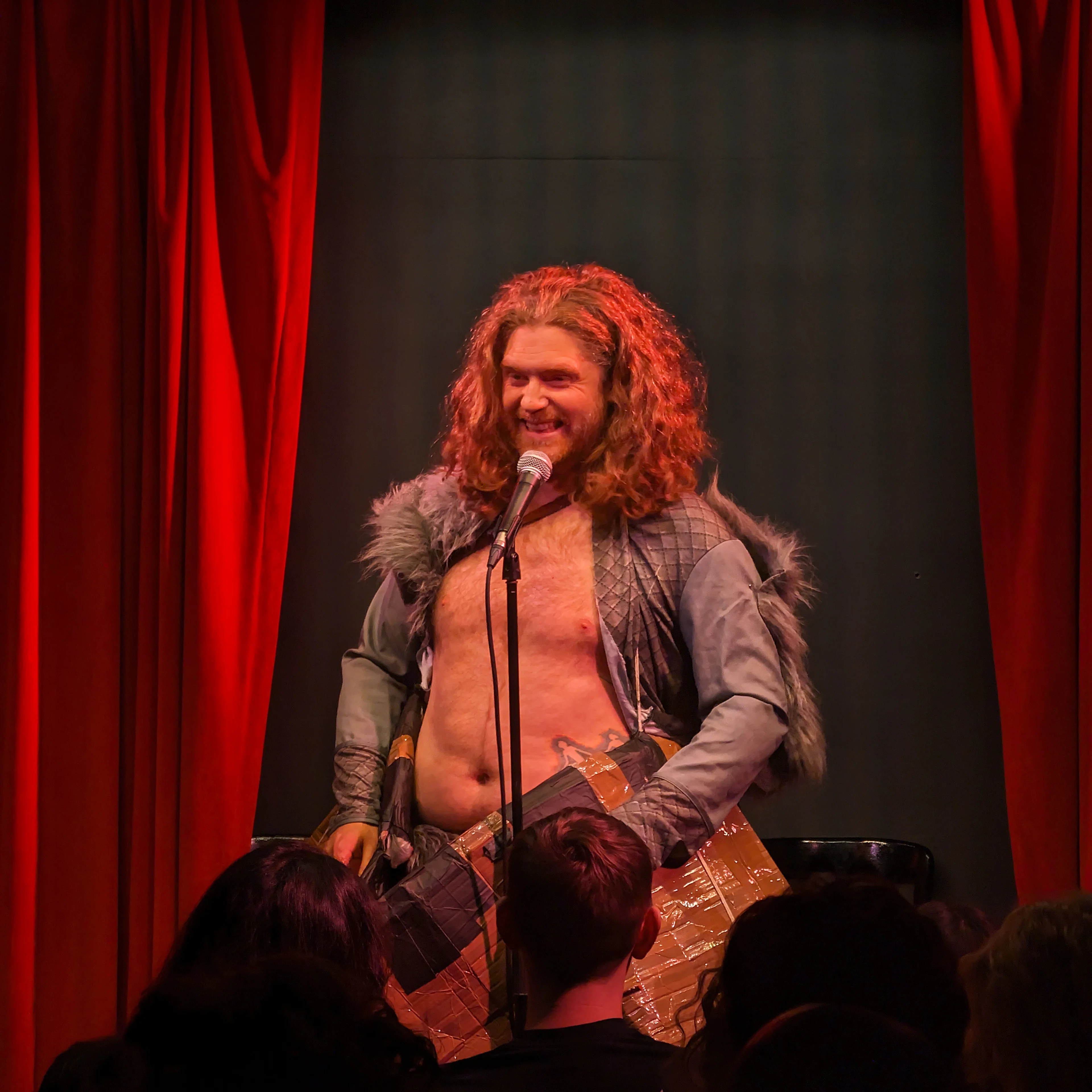 David Hoskin is the Viking! David Hoskin on stage dressed up as a viking and has a boat attached to him.