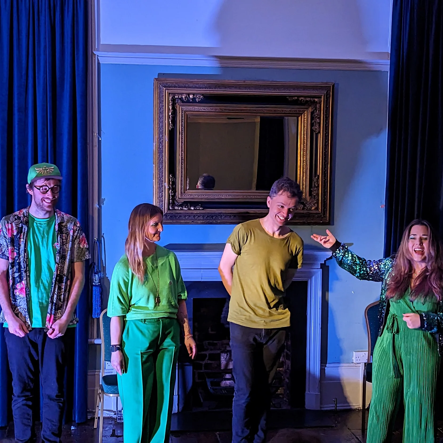 Kerfuffle performing on St Patricks day 2023 Kerfuffle performing on St Patricks day 2023. 4 members of the improv group Kerfuffle are on stage and dressed in green.