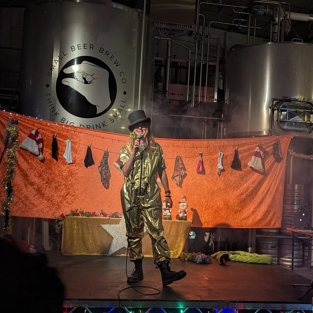 MC Viki Jackson at Modern Art Dec Comedian Viki Jackson stood on stage