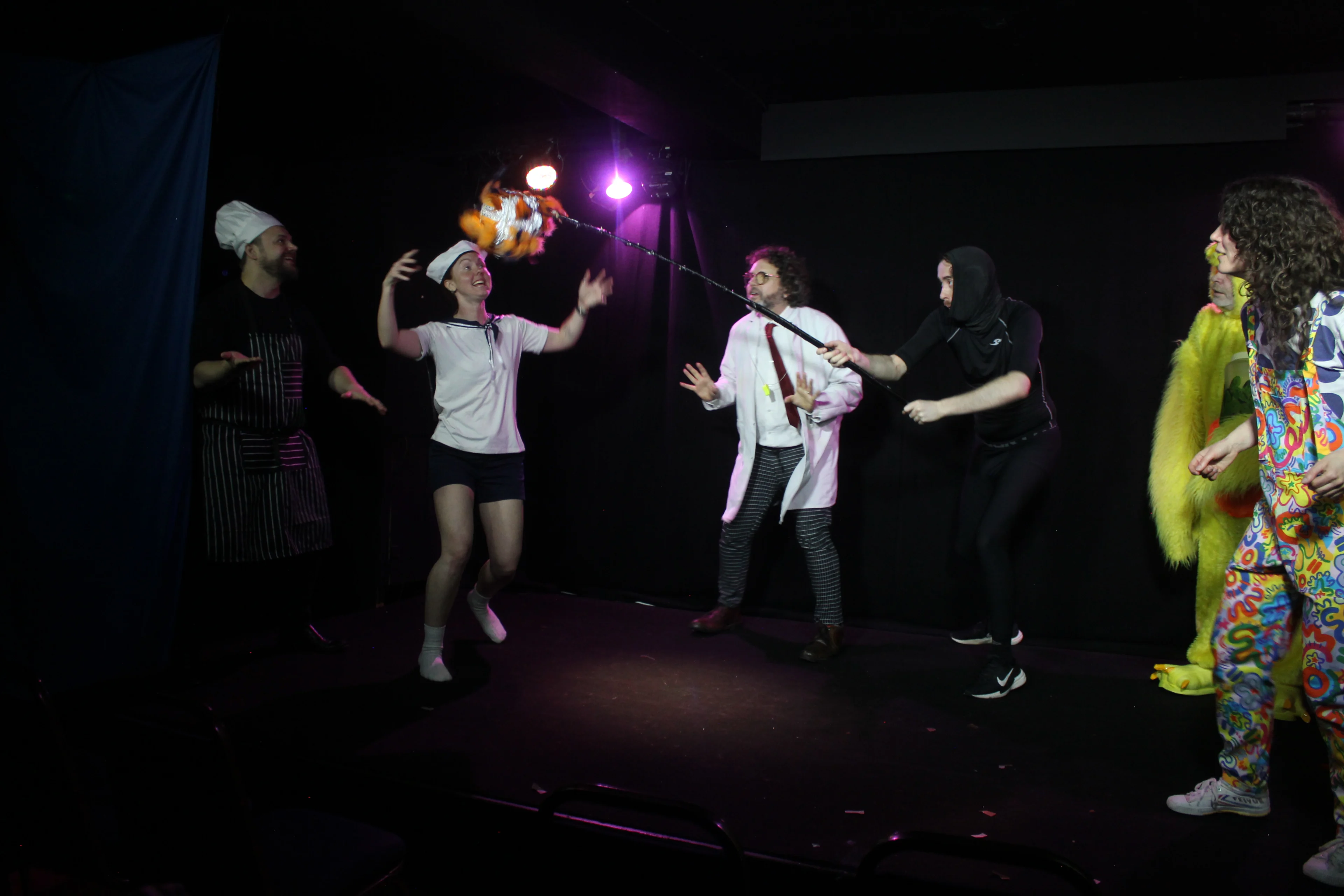 Ohh Baby! cast playing wiffleball on stage 