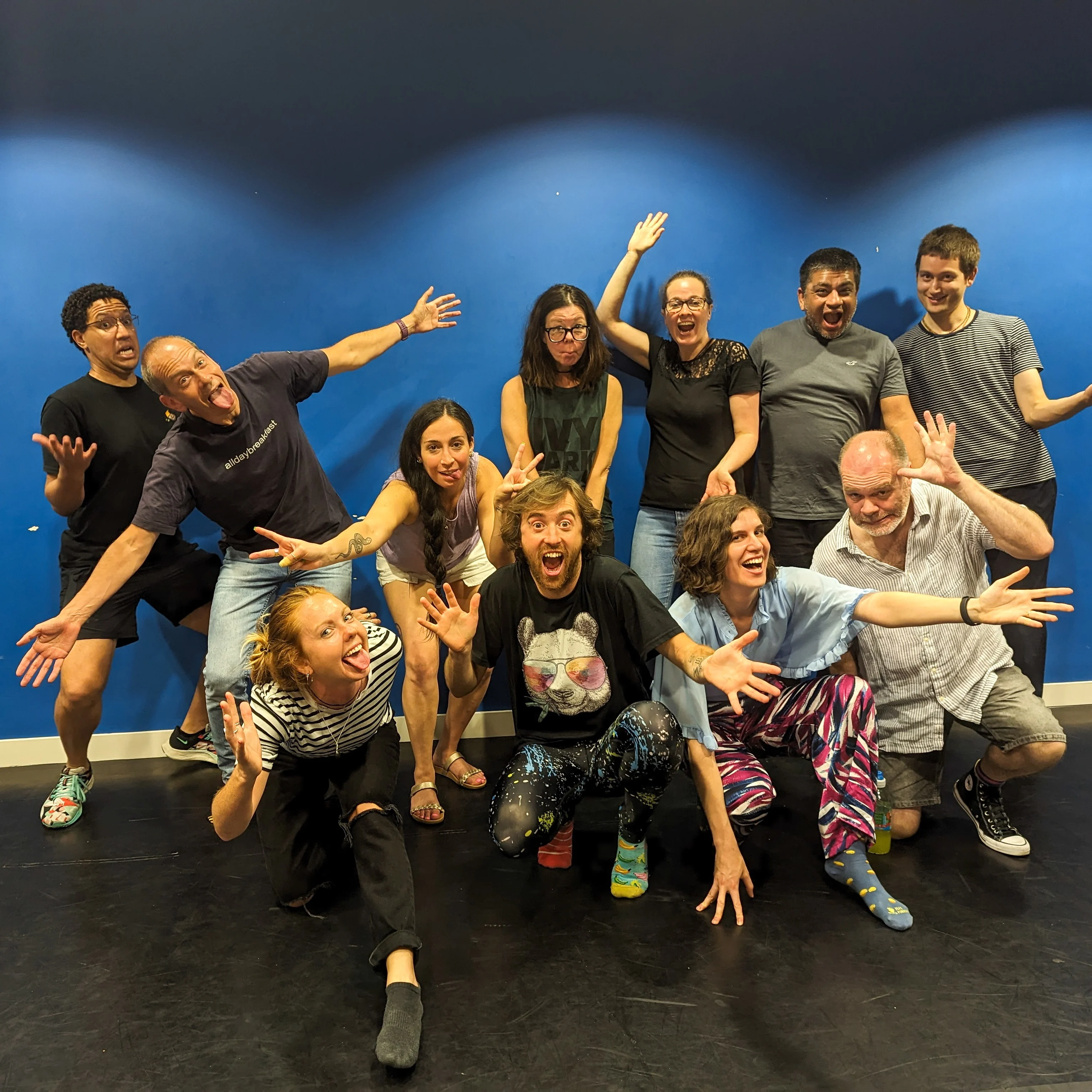 Clowning workshop - clowning for improv Clowning workshop group photo with arm in the air and smiling