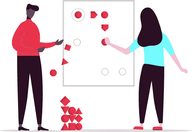 A woman and a man are standing if front of the whiteboard on which differently shaped red blocks are arranged into a workflow graph. The woman is adding a red block onto the board. The man is pointing at the board.