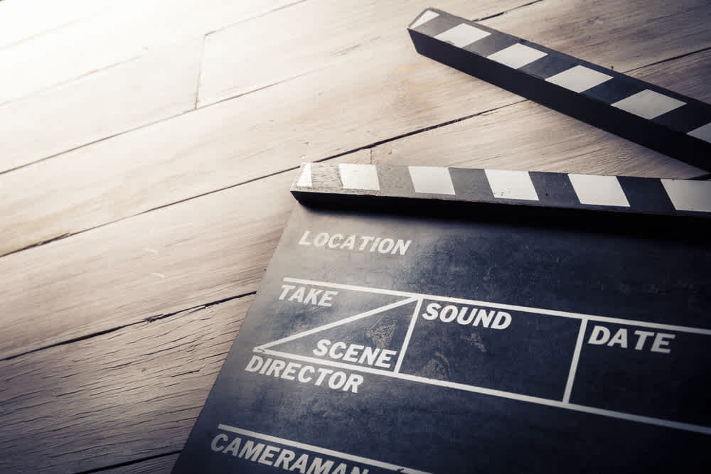 vintage photo of movie clapper on wood