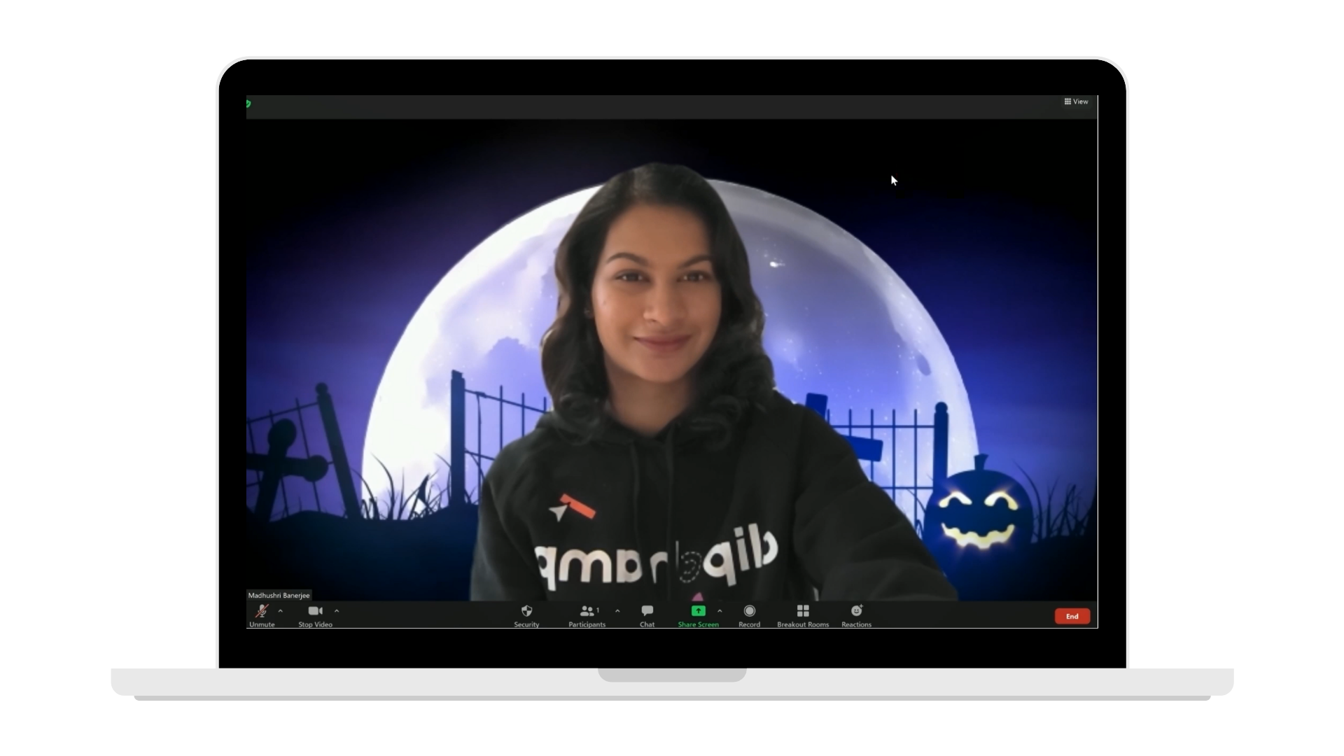 Clipchamp Halloween Zoom background preview on a laptop