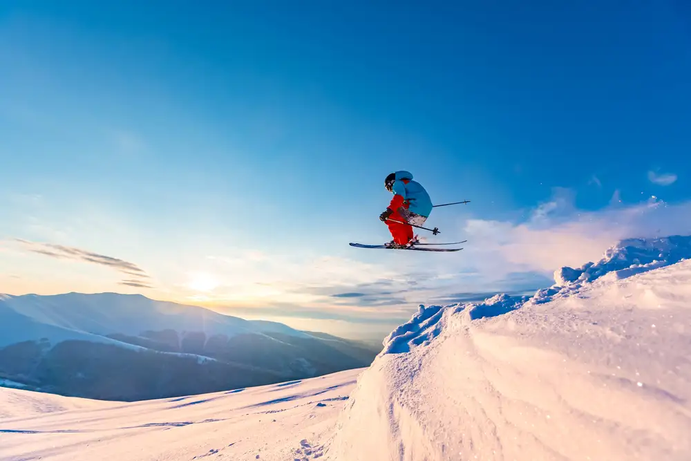 Skiing jump in the snowy mountains in freeze frame