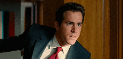 Ryan Reynolds looking left and right GIF