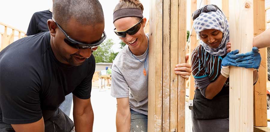 group of people building house