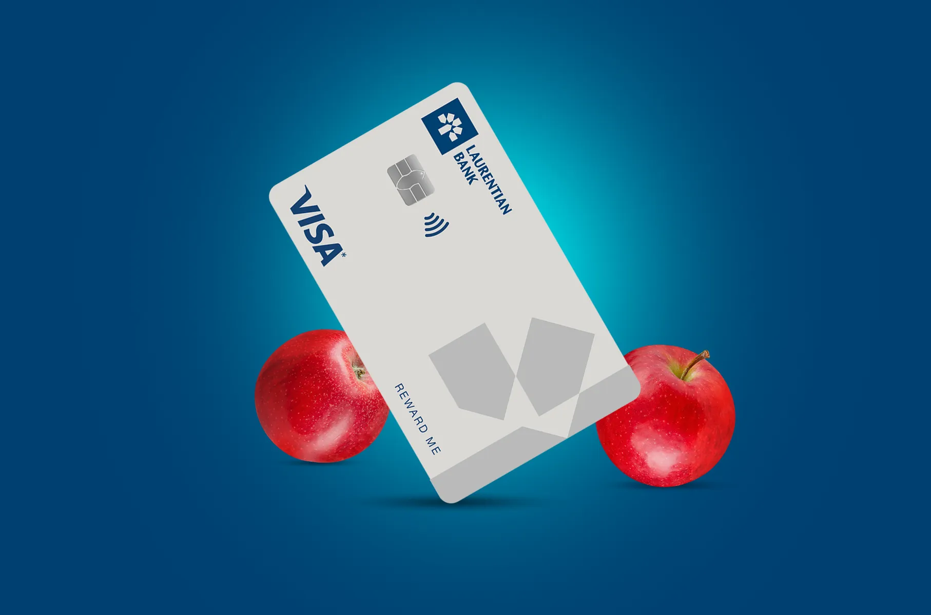 The Laurentian Bank Visa* Reward Me card surrounded by fresh, red apples.